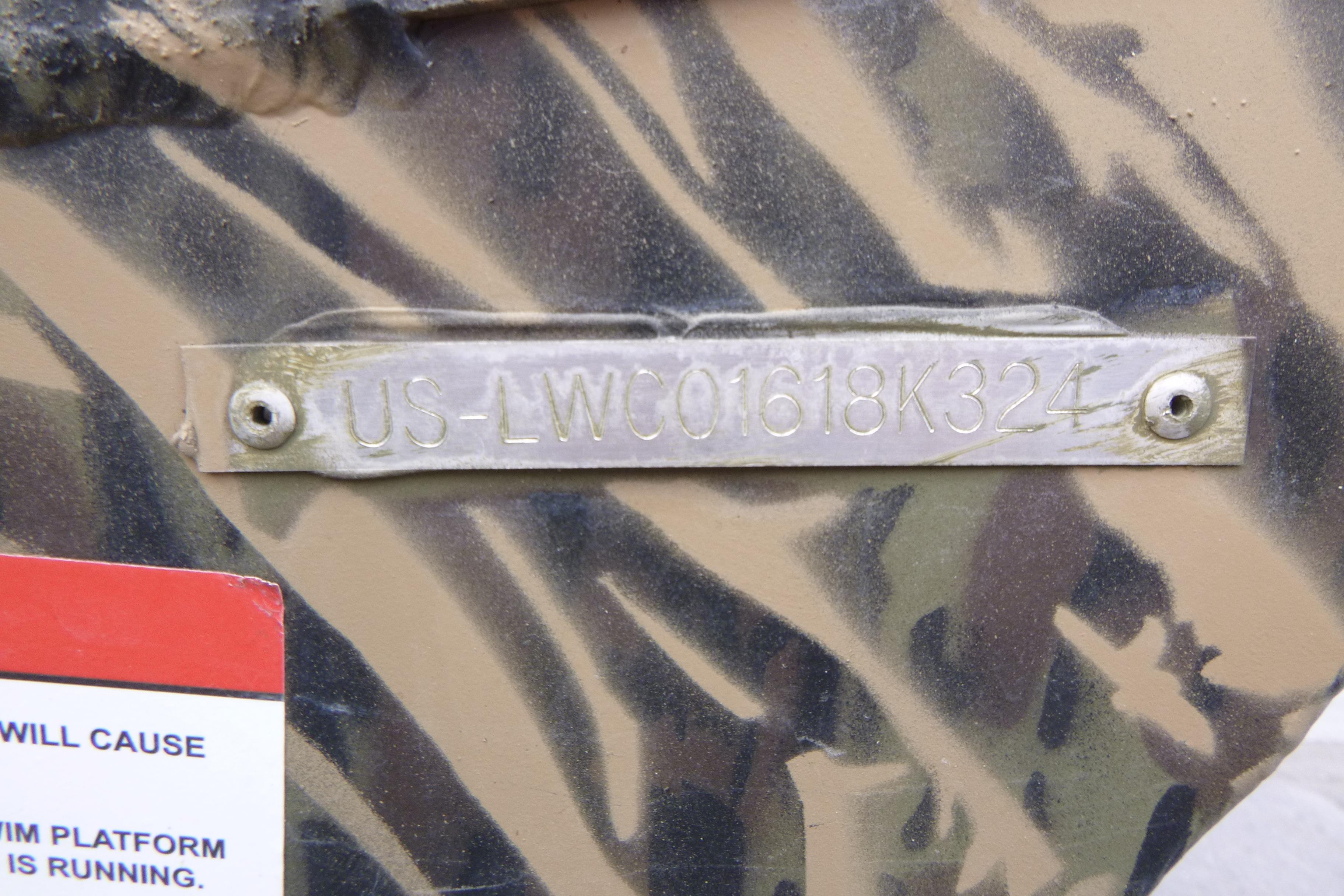 2024 Lowe Roughneck 2070 boat with camouflage pattern and visible hull identification number.
