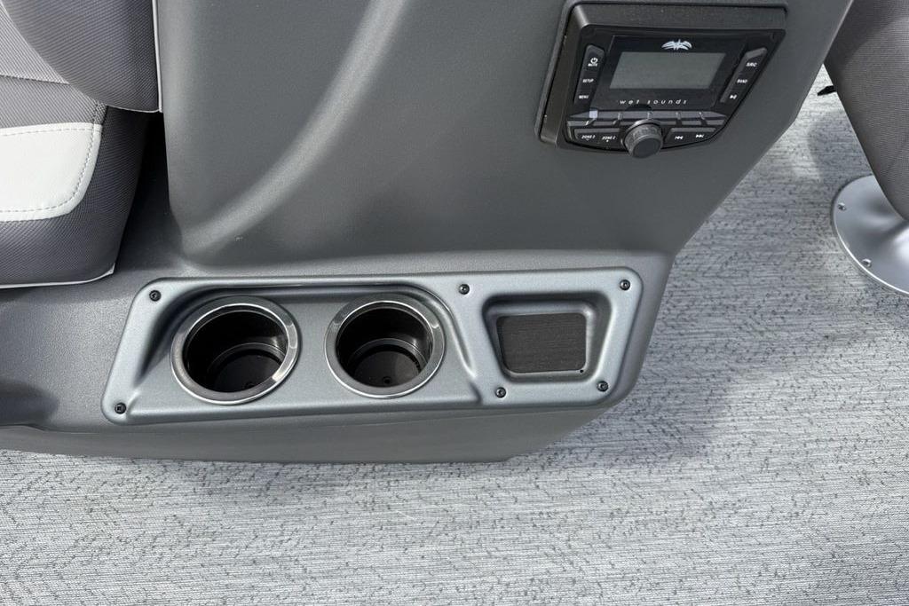 2026 Sun Tracker Bass Buggy 16 XL Select console with cup holders and audio controls.