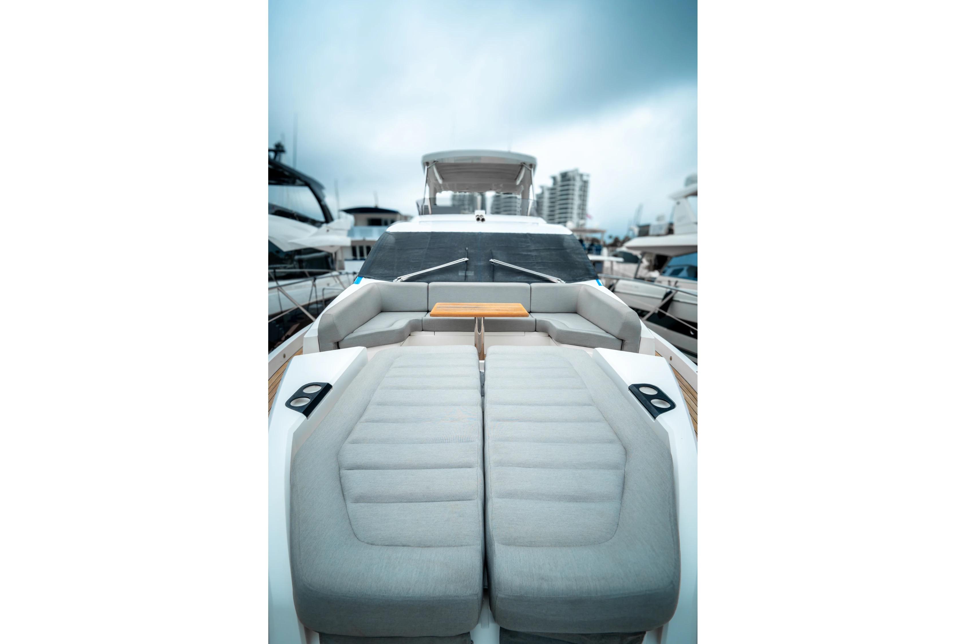 2018 Sunseeker Manhattan 66 yacht with luxurious deck seating and sleek design.