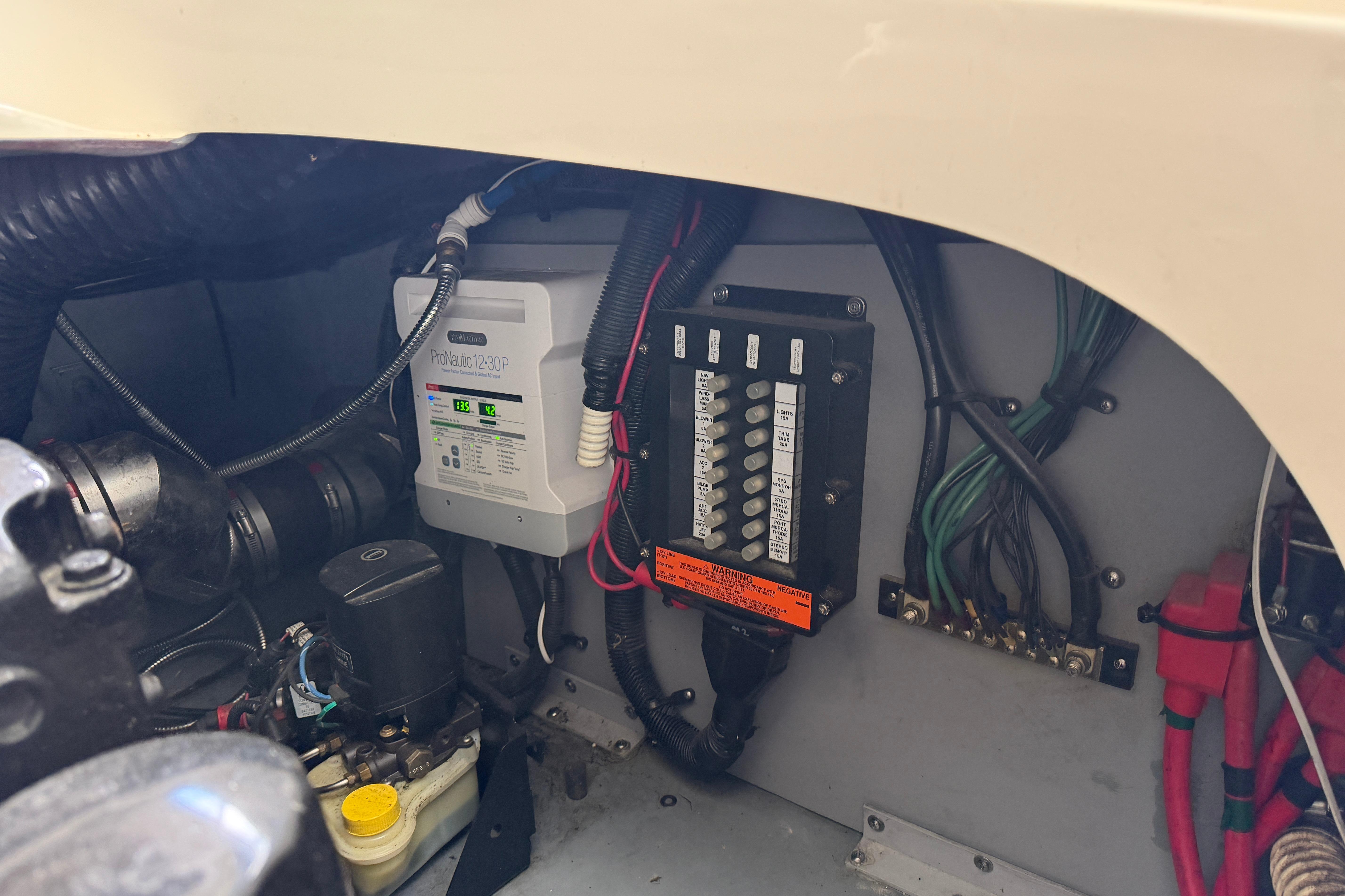 Engine compartment of a 2003 Sea Ray 290 Bowrider, showing electrical components and wiring.