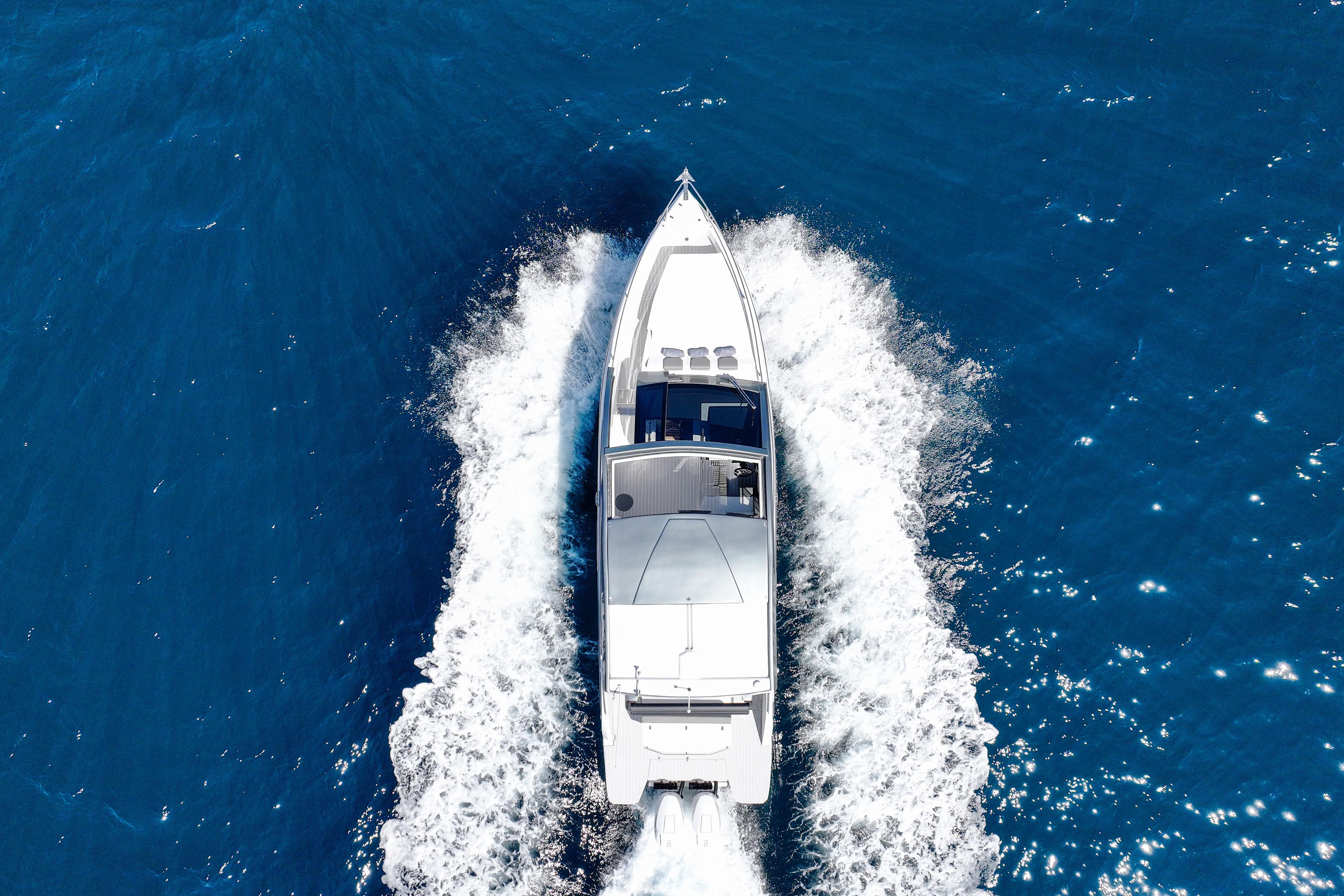Aerial view of 2025 VALIATT YACHTS 380 Bowrider cruising on blue ocean waters.