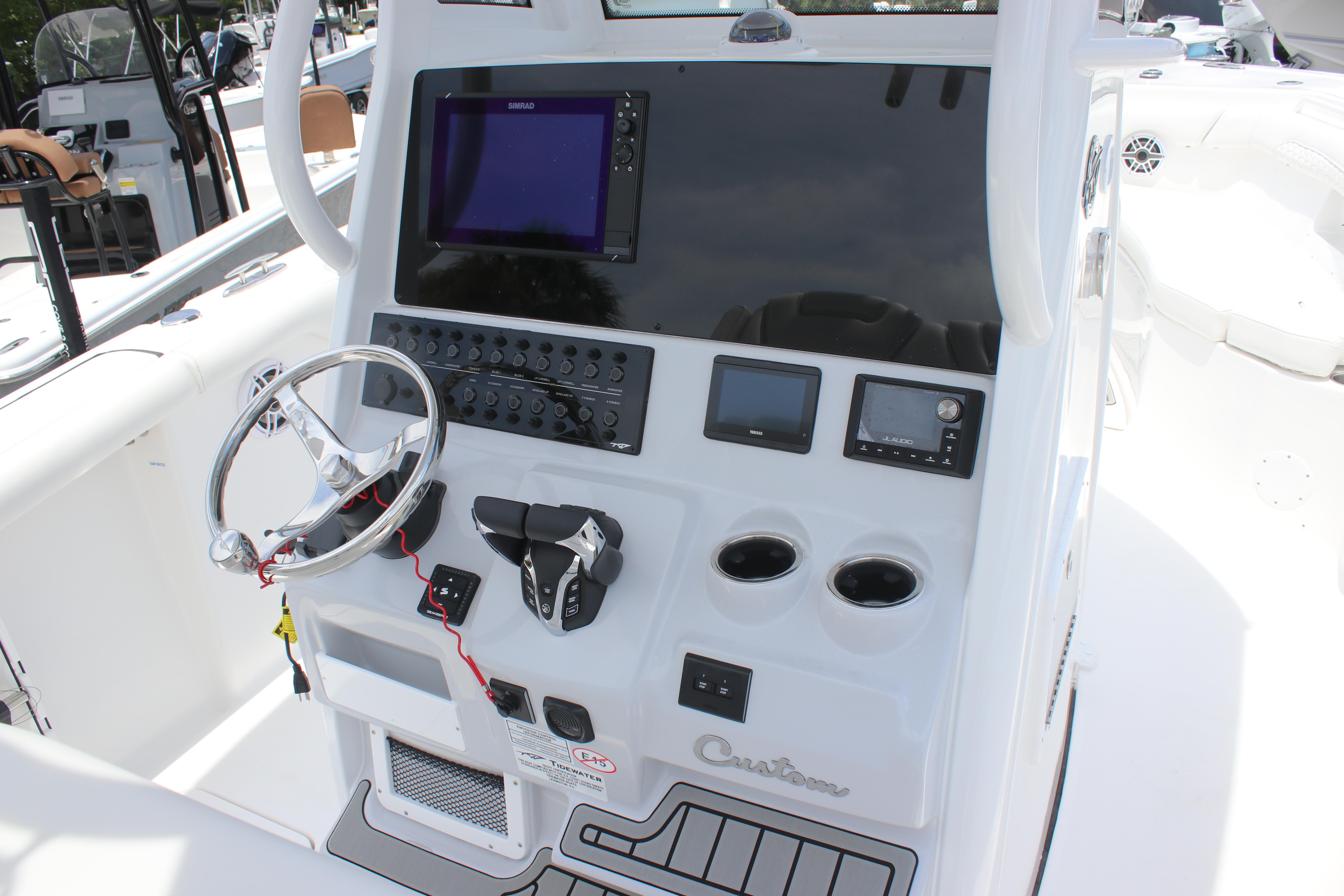 2026 Tidewater 272 LXF boat dashboard with steering wheel and electronic controls.