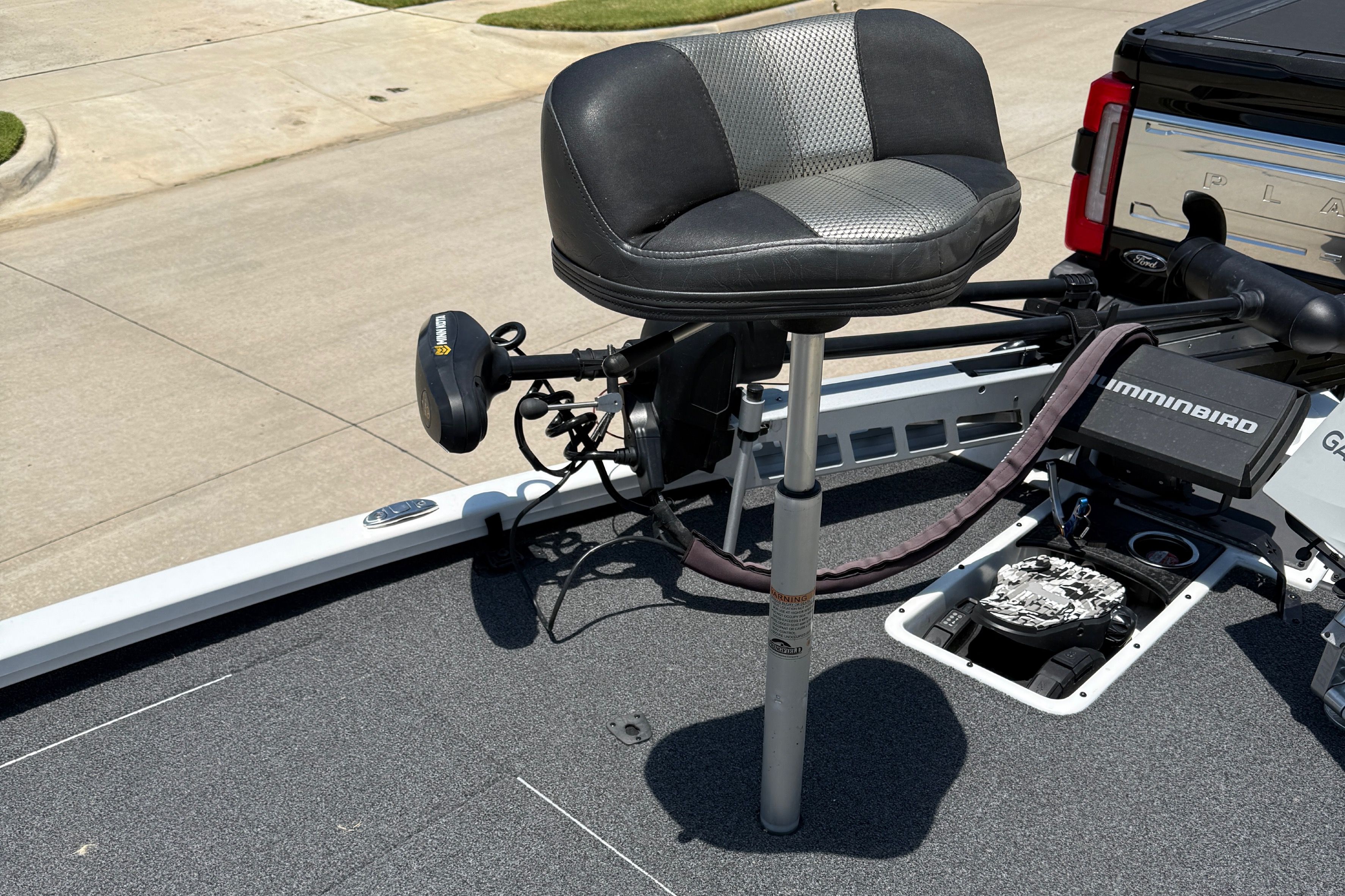 A 2019 Vexus AVX1980 with a cushioned seat and a Minn Kota trolling motor on the deck.
