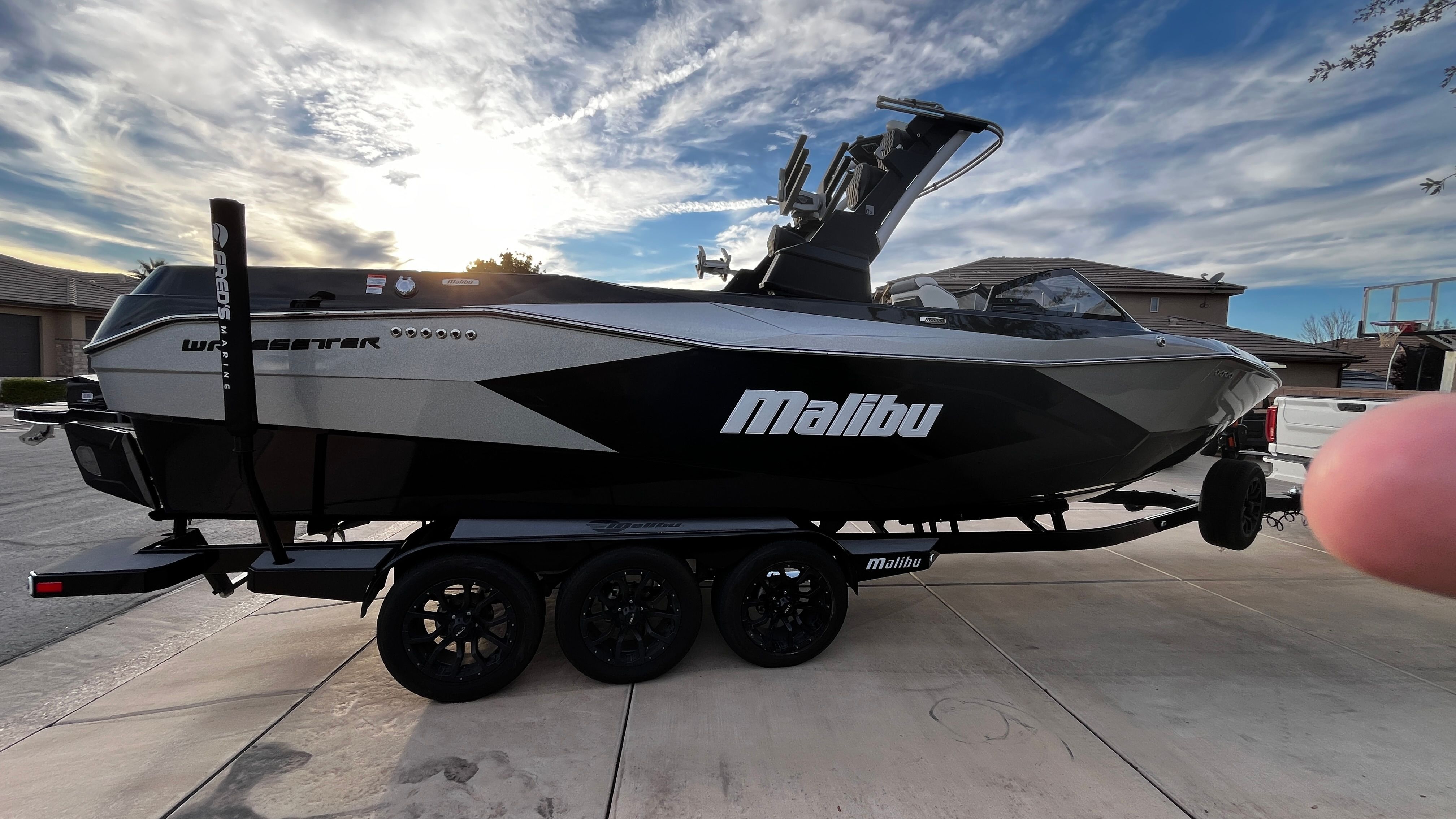 A 2023 Malibu Wakesetter 26 LSV on a trailer, ready for watersport adventures.