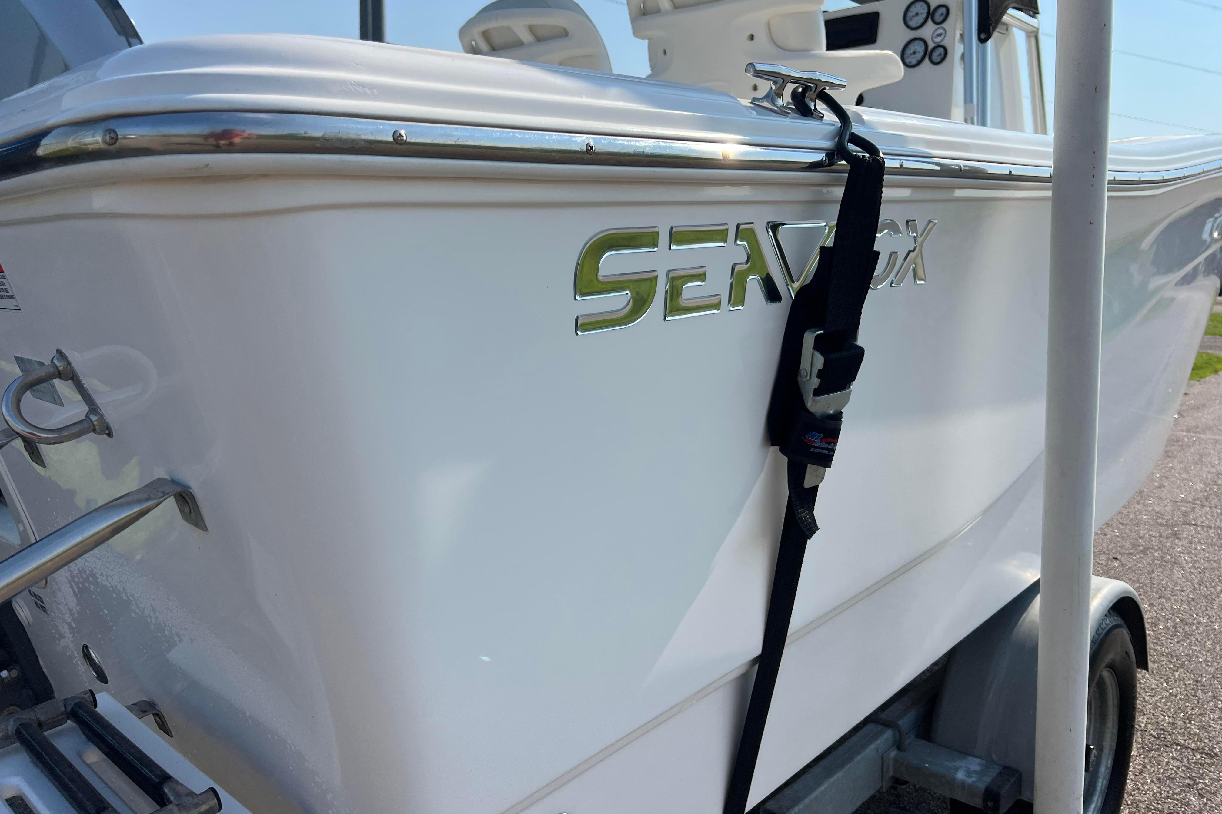 2012 Sea Fox 206 Center Console boat on trailer, close-up view.