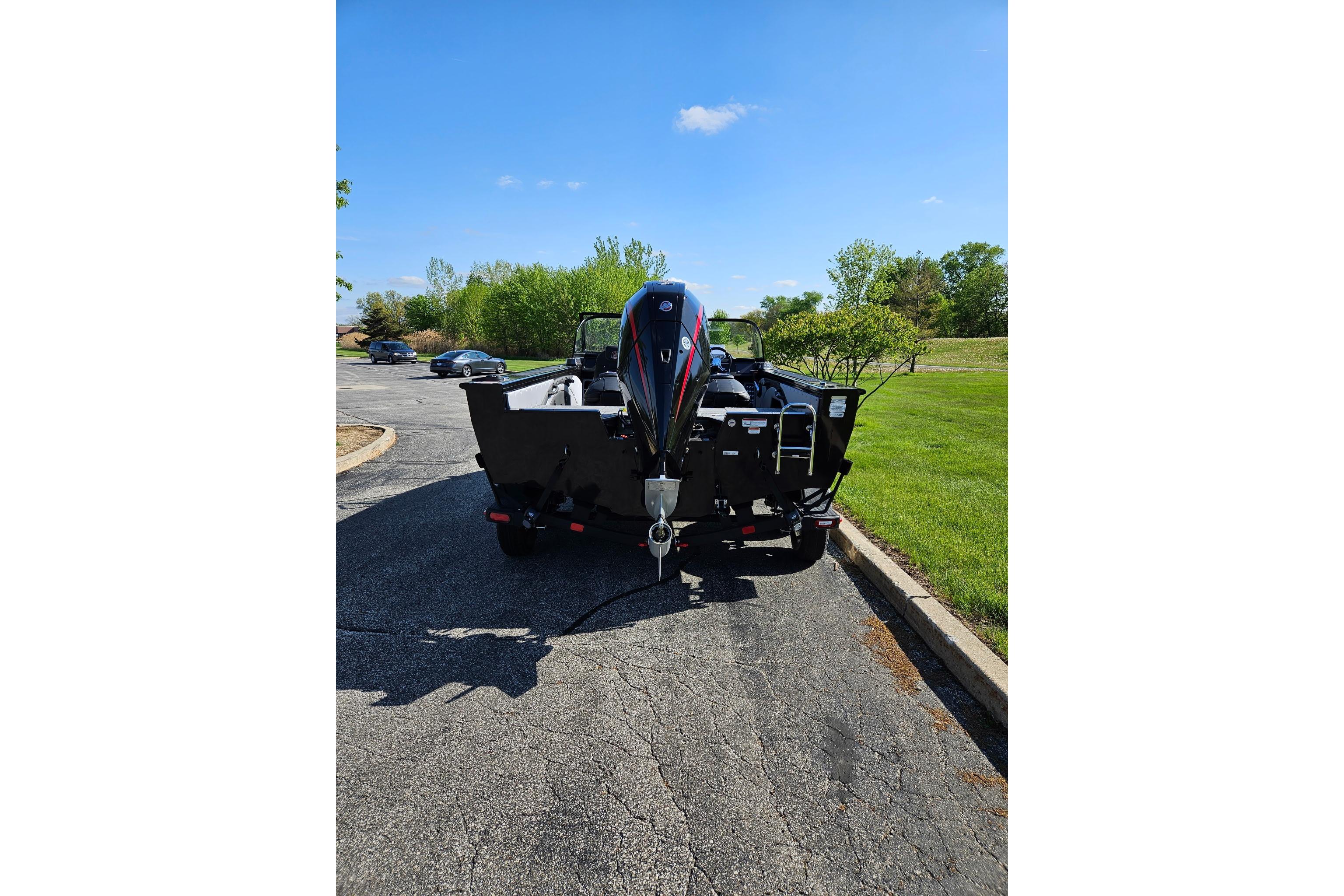 2026 Ranger VX1888 WT boat on trailer, parked on sunny day.