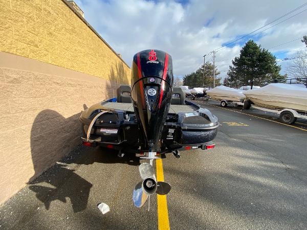 2025 Nitro Z18 Pro boat with powerful outboard motor in parking lot.