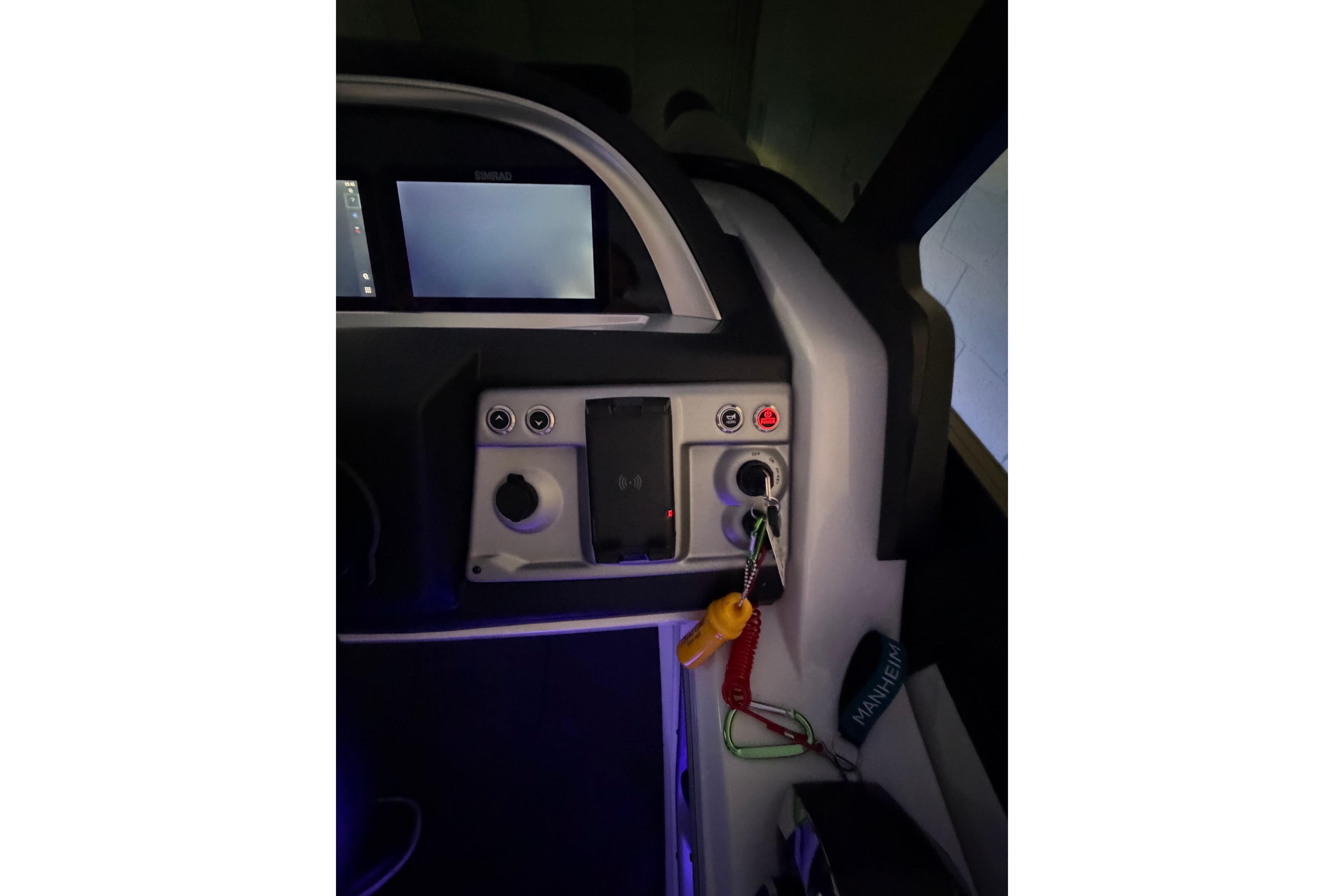Control panel of 2026 South Bay 525SB2 boat with keys and digital display.