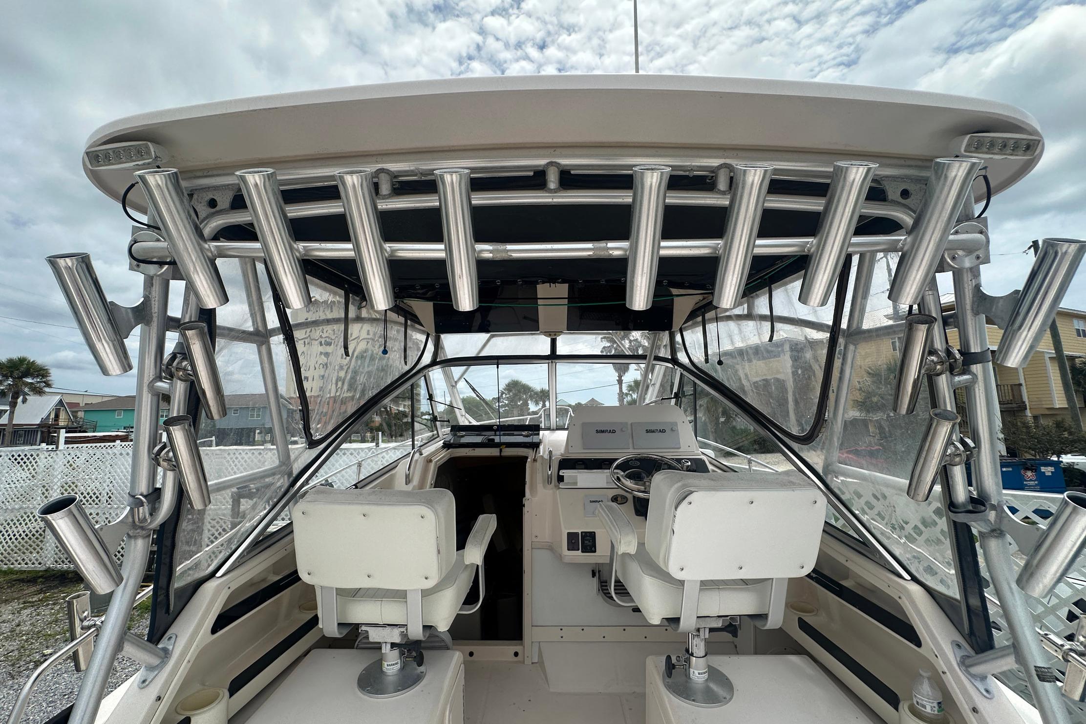2006 Grady-White Marlin 300 boat interior with helm and rod holders.