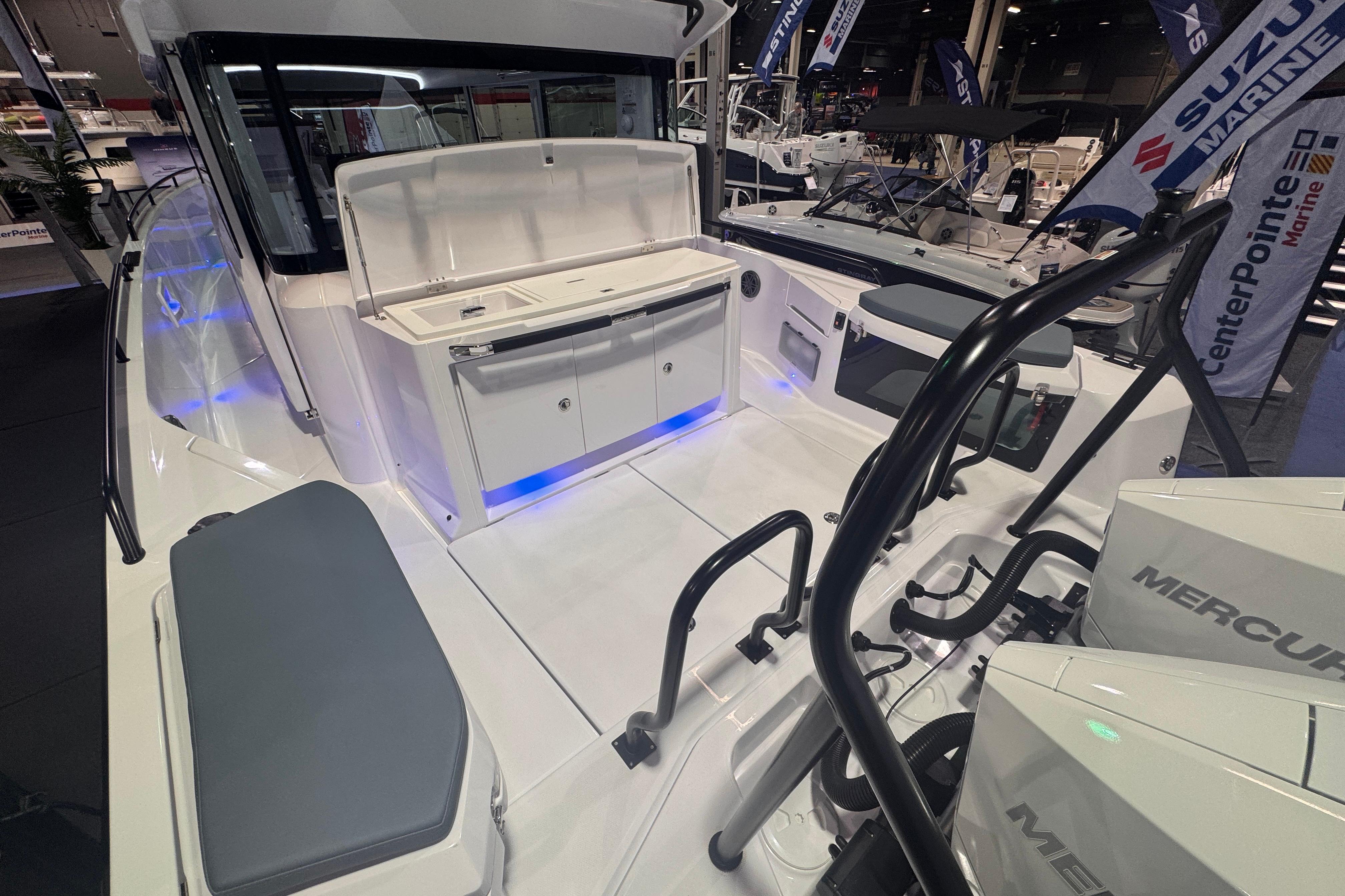 2025 Axopar 37 XC Cross Cabin boat interior with seating and Mercury engines.