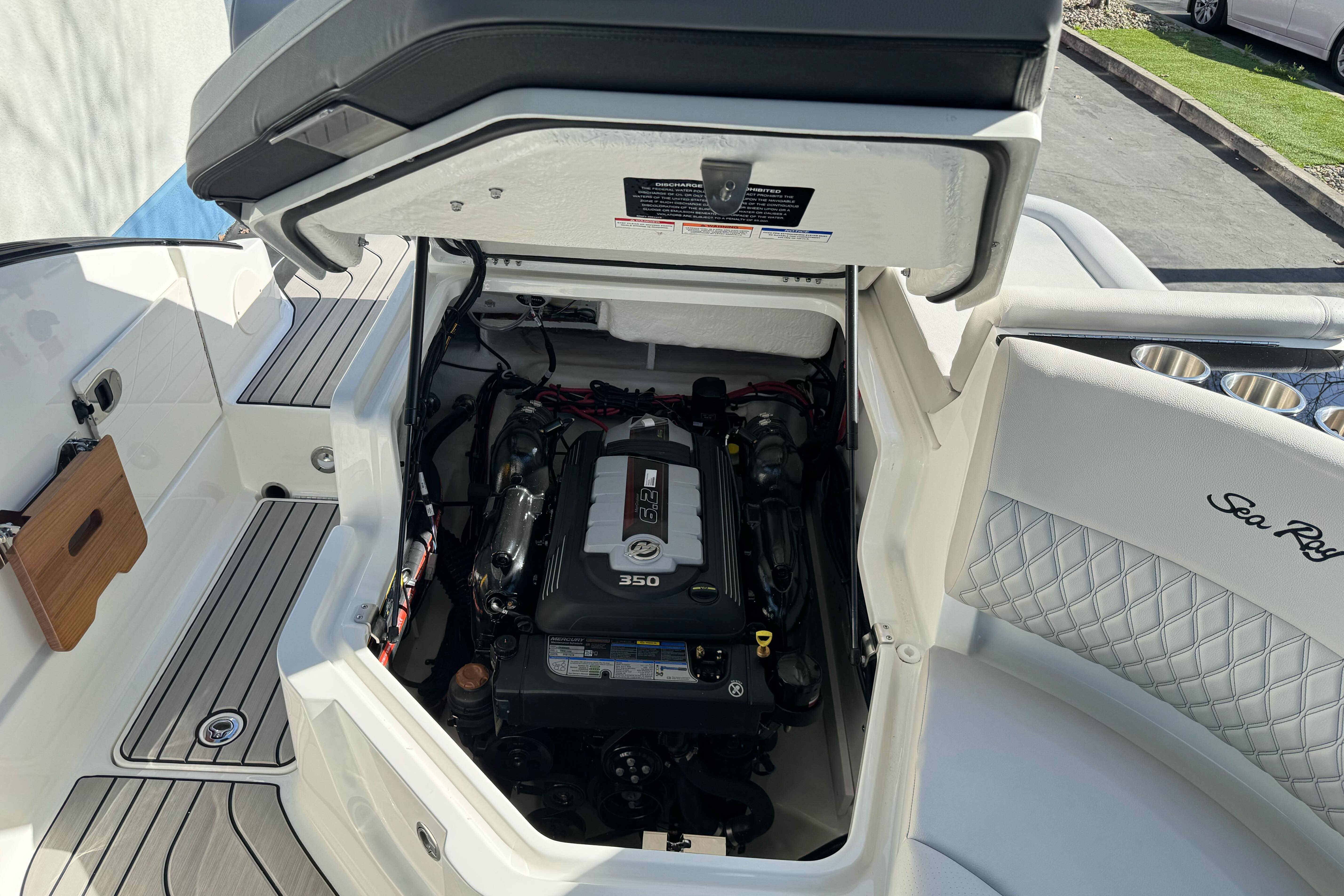 2026 Sea Ray SLX 260 boat engine compartment with open hatch, showcasing the 350 engine.