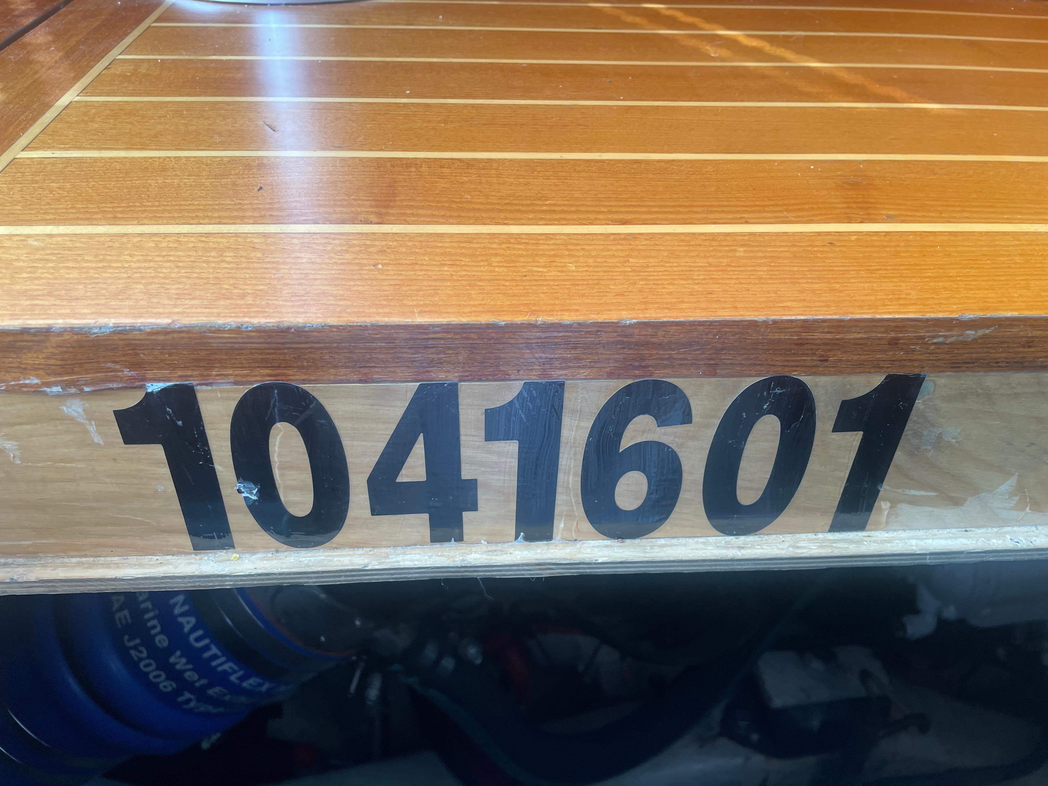 Wooden surface with number 1041601, Lyman-Morse Custom Flybridge, 1997 model.