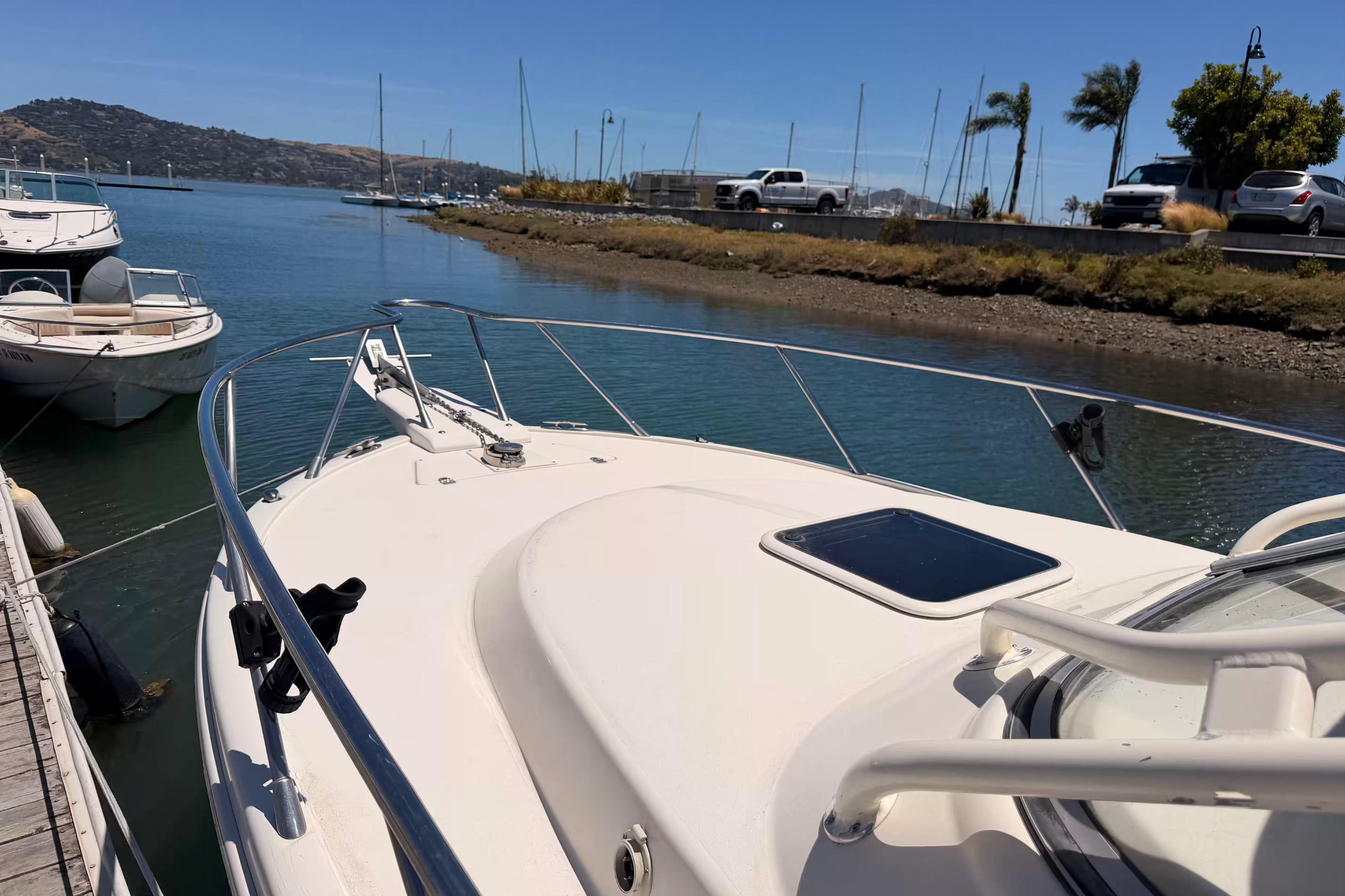 2007 Scout 262 Abaco boat docked in a serene marina setting.