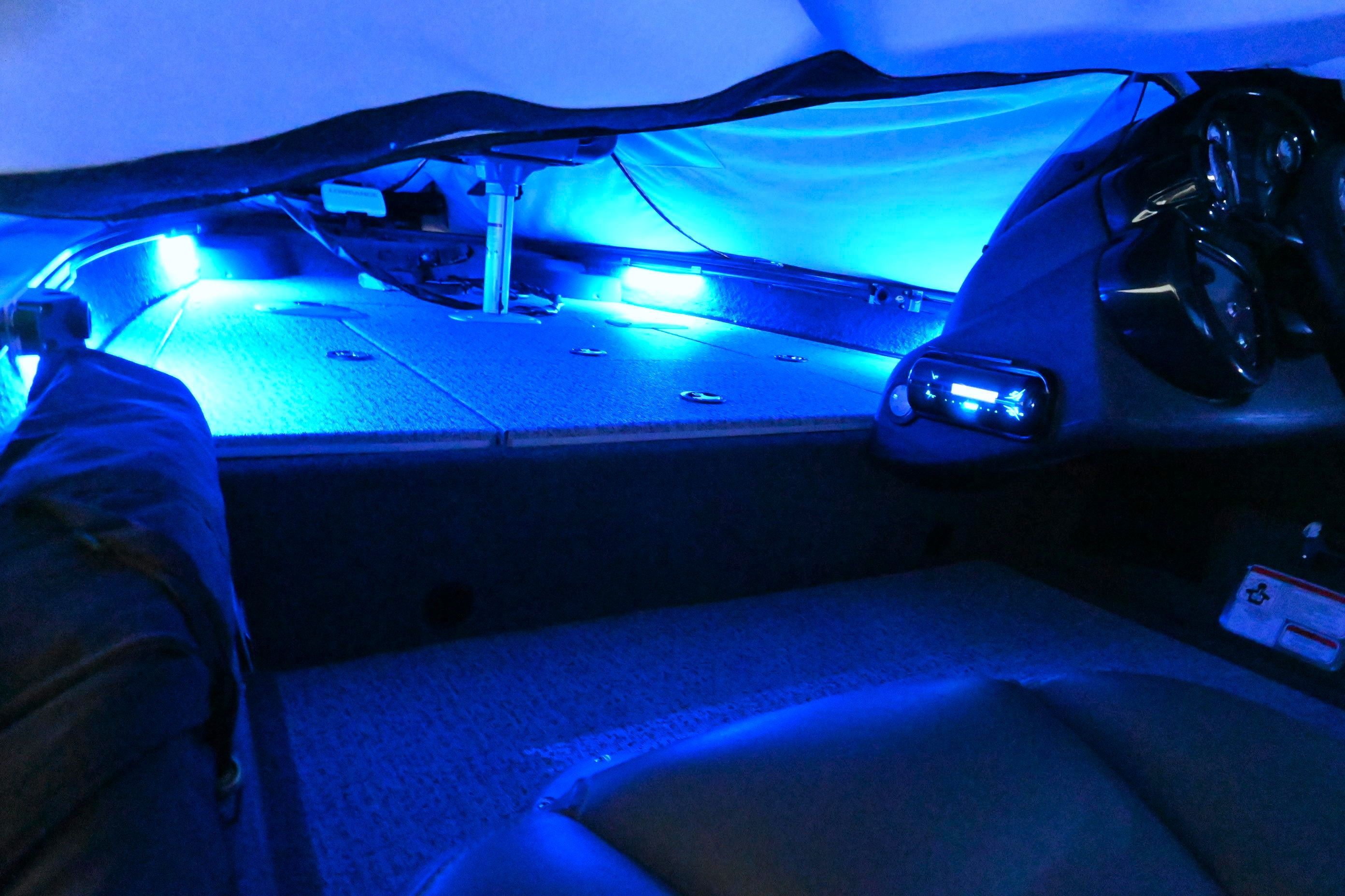 Interior of Tracker Pro 175 TF with blue lighting.