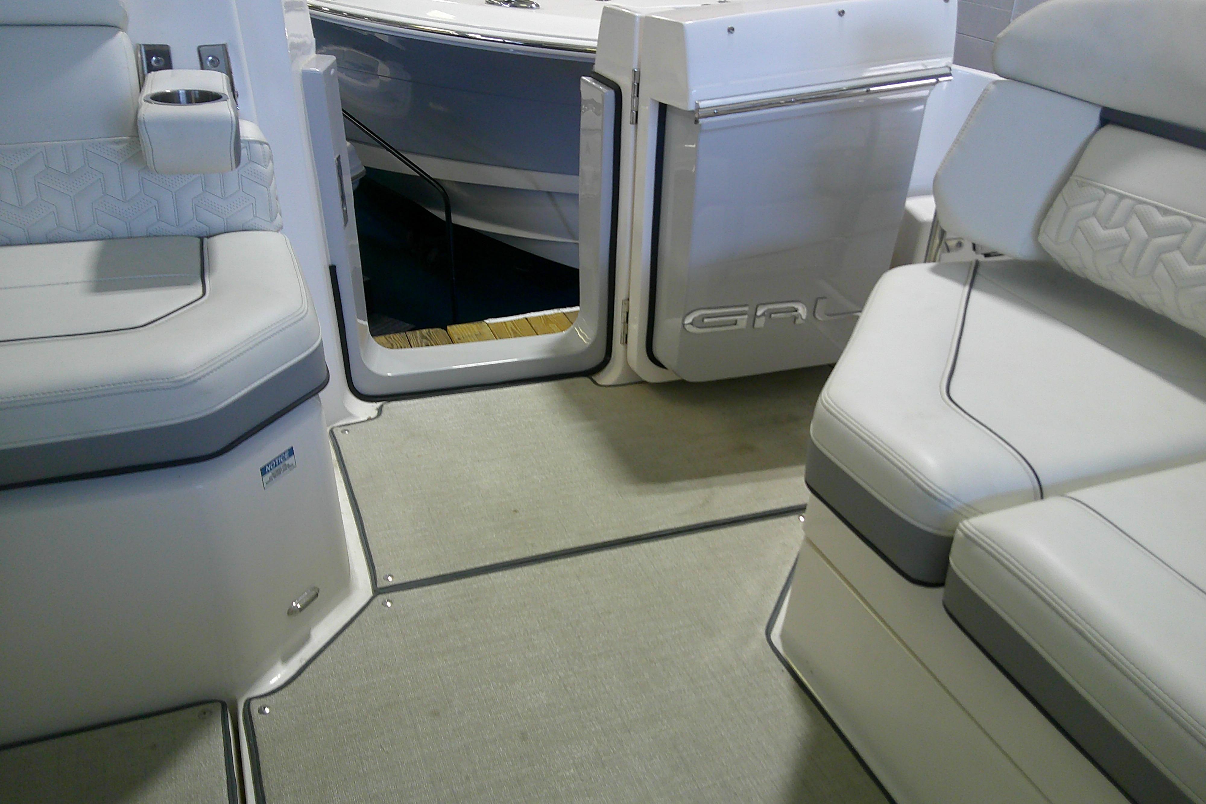 Interior of 2023 Regal LX36 boat, featuring luxurious seating and modern design elements.