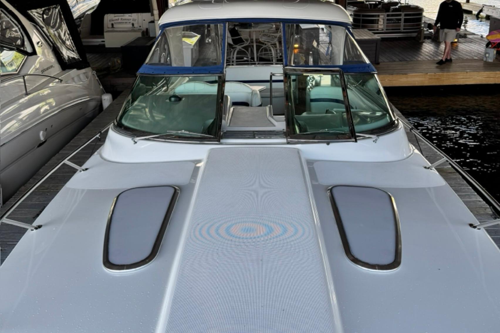 2008 Formula 400 Super Sport boat docked, showcasing sleek design and spacious deck.