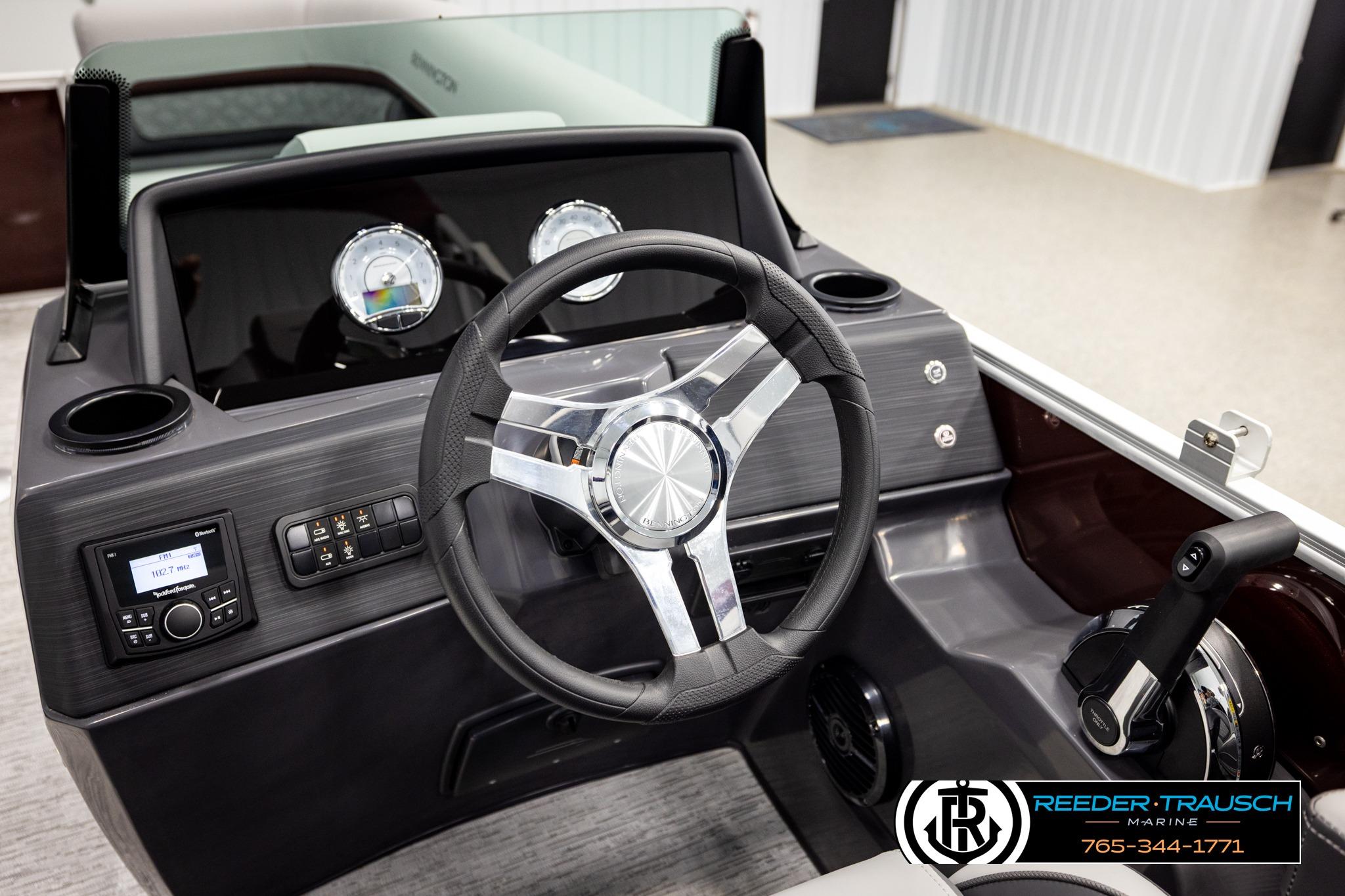 2026 Bennington S20 Luxe boat dashboard with steering wheel and control panel.