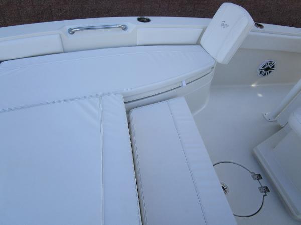 2024 Ranger 2660 Bay boat interior with white cushioned seating and storage compartments.