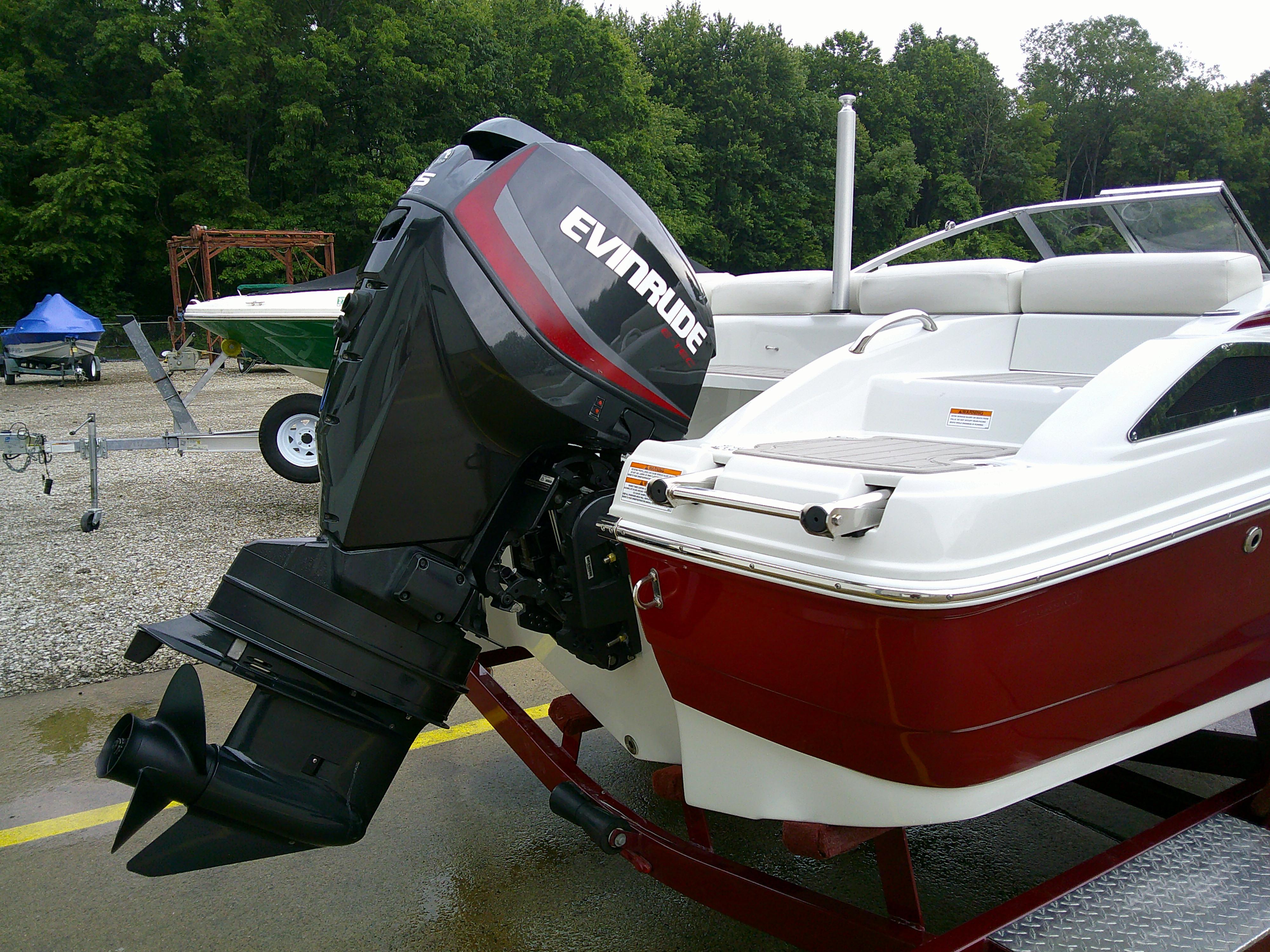 2019 Crownline 19 XS boat with Evinrude outboard motor, parked on a trailer.