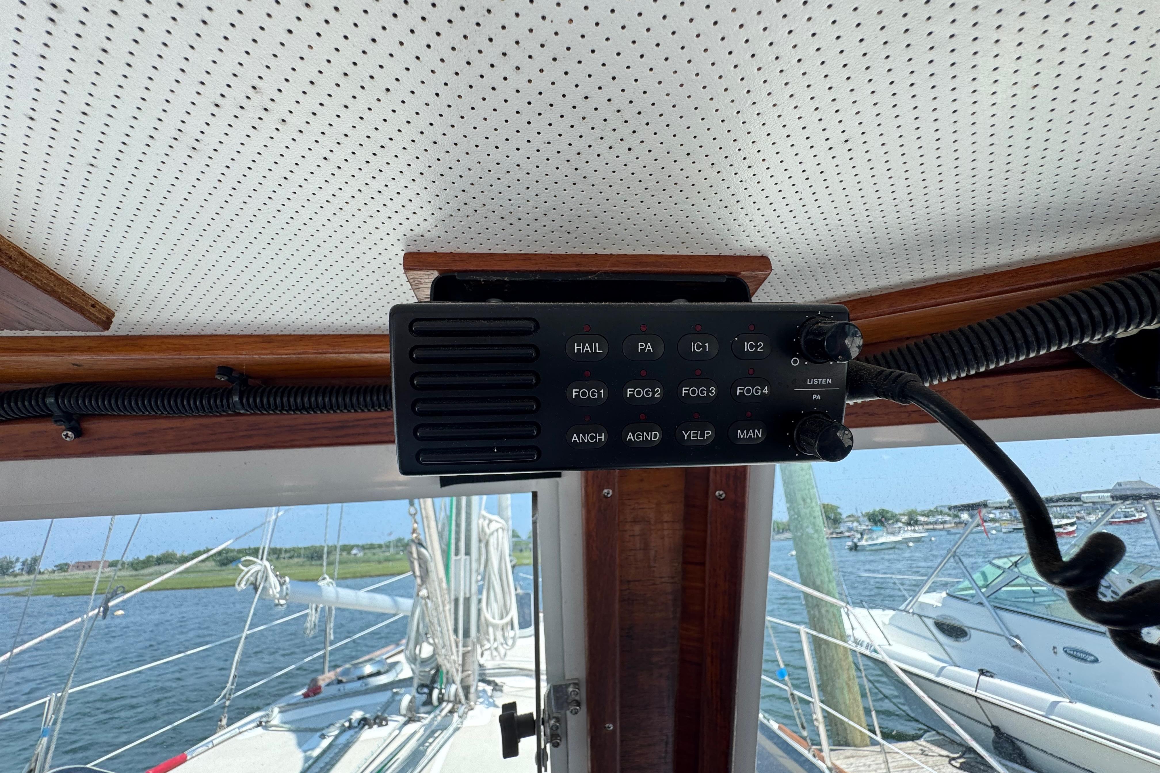 Interior view of a 1989 Cape Dory 30 Motorsailer with a mounted communication device.