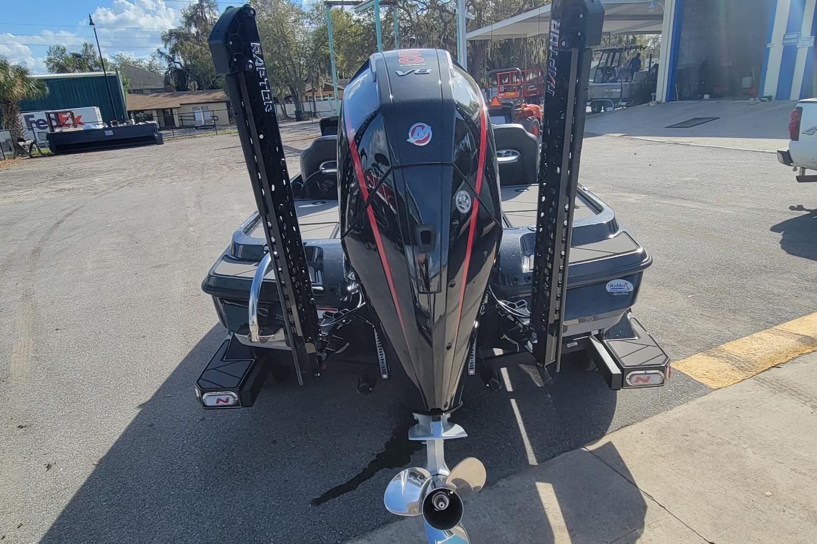 2026 Nitro Z20 XL Pro boat with powerful outboard motor in a sunny outdoor setting.
