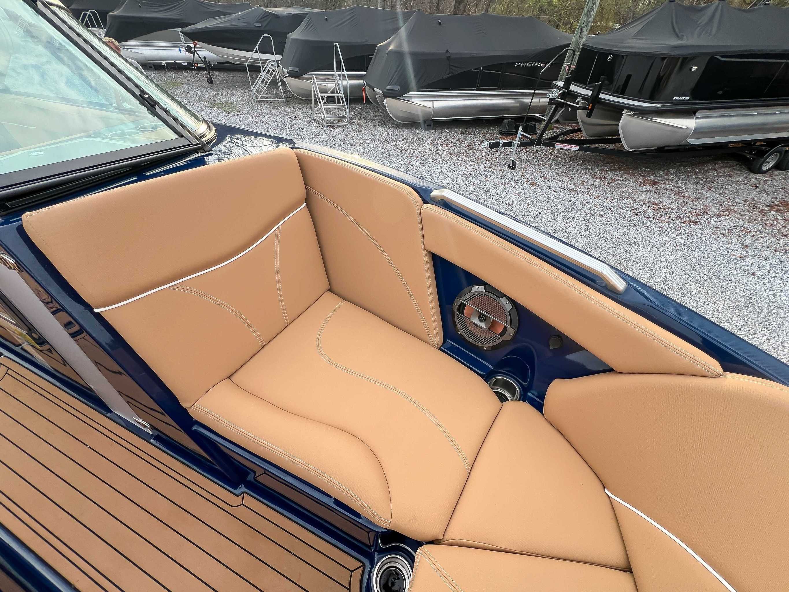2021 MasterCraft XT22 with beige seating and speaker.