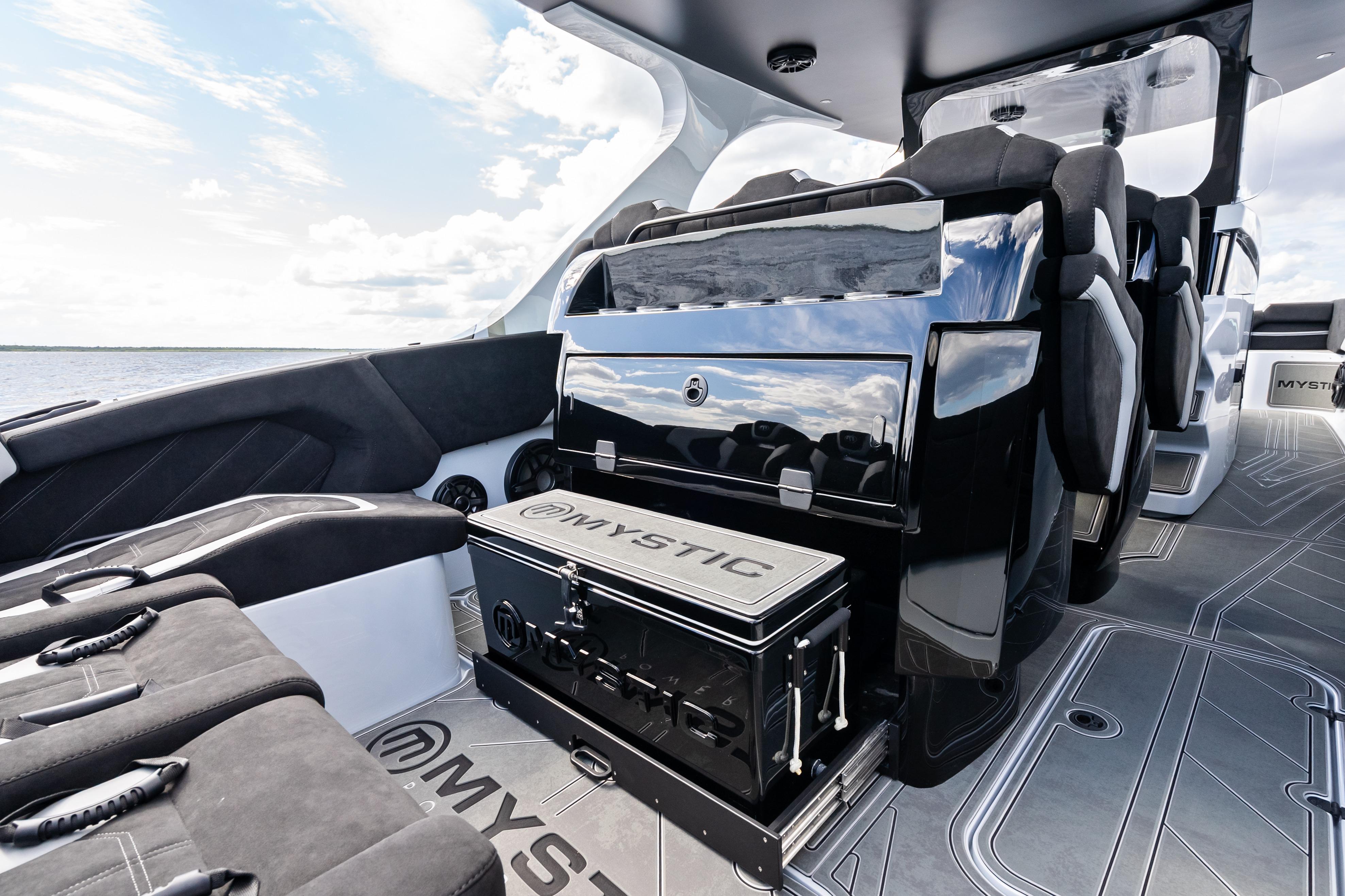 2027 Mystic Powerboats M4200 interior showcasing sleek seating and modern design on open water.