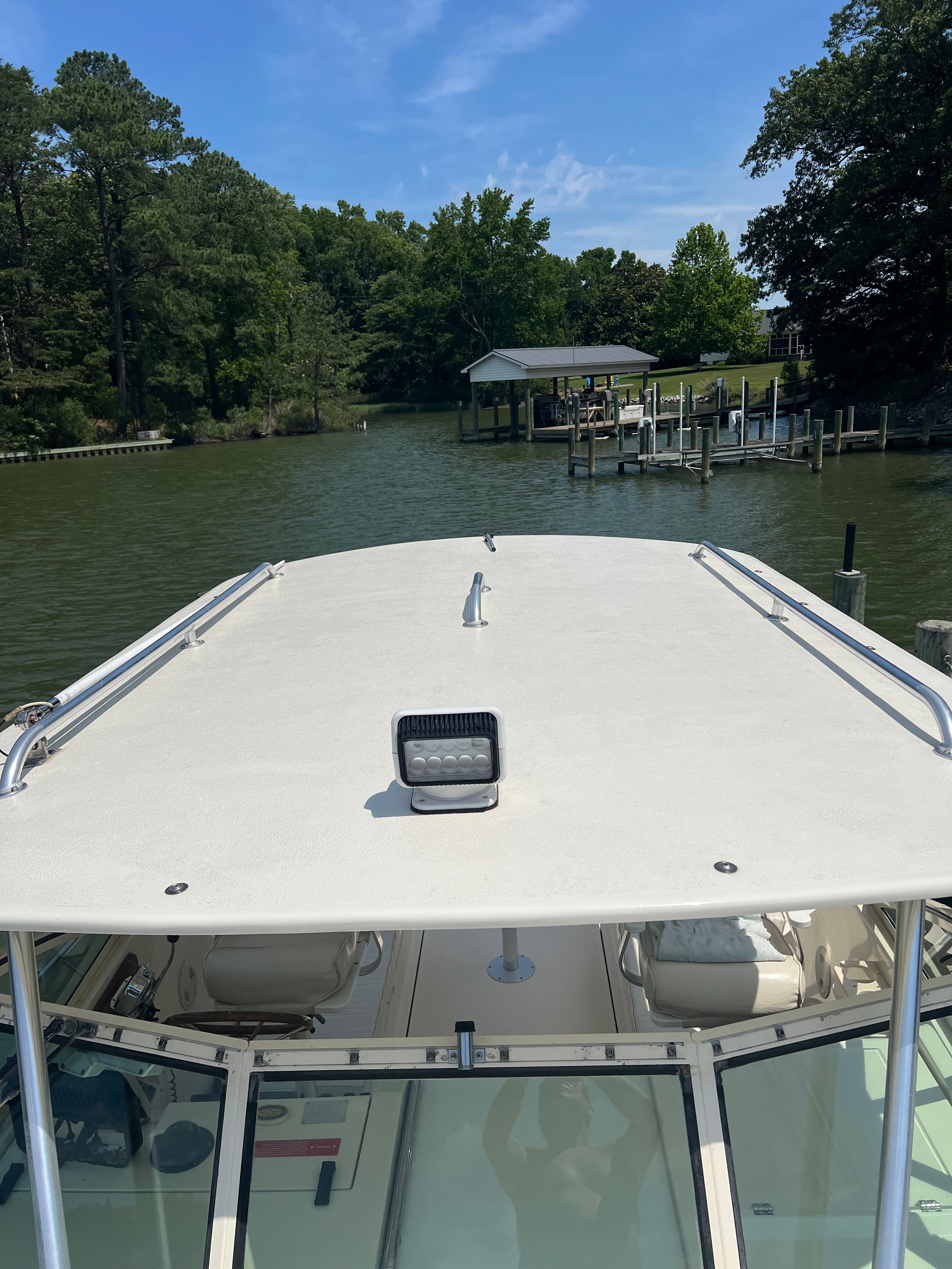 2003 Mainship Pilot 30-II boat on calm water.