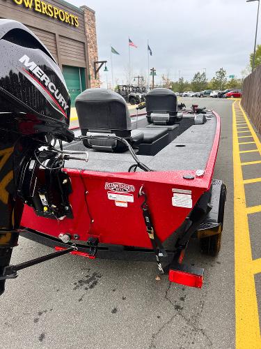 2025 Tracker Panfish 17 boat with Mercury engine, parked outside a powersports store.