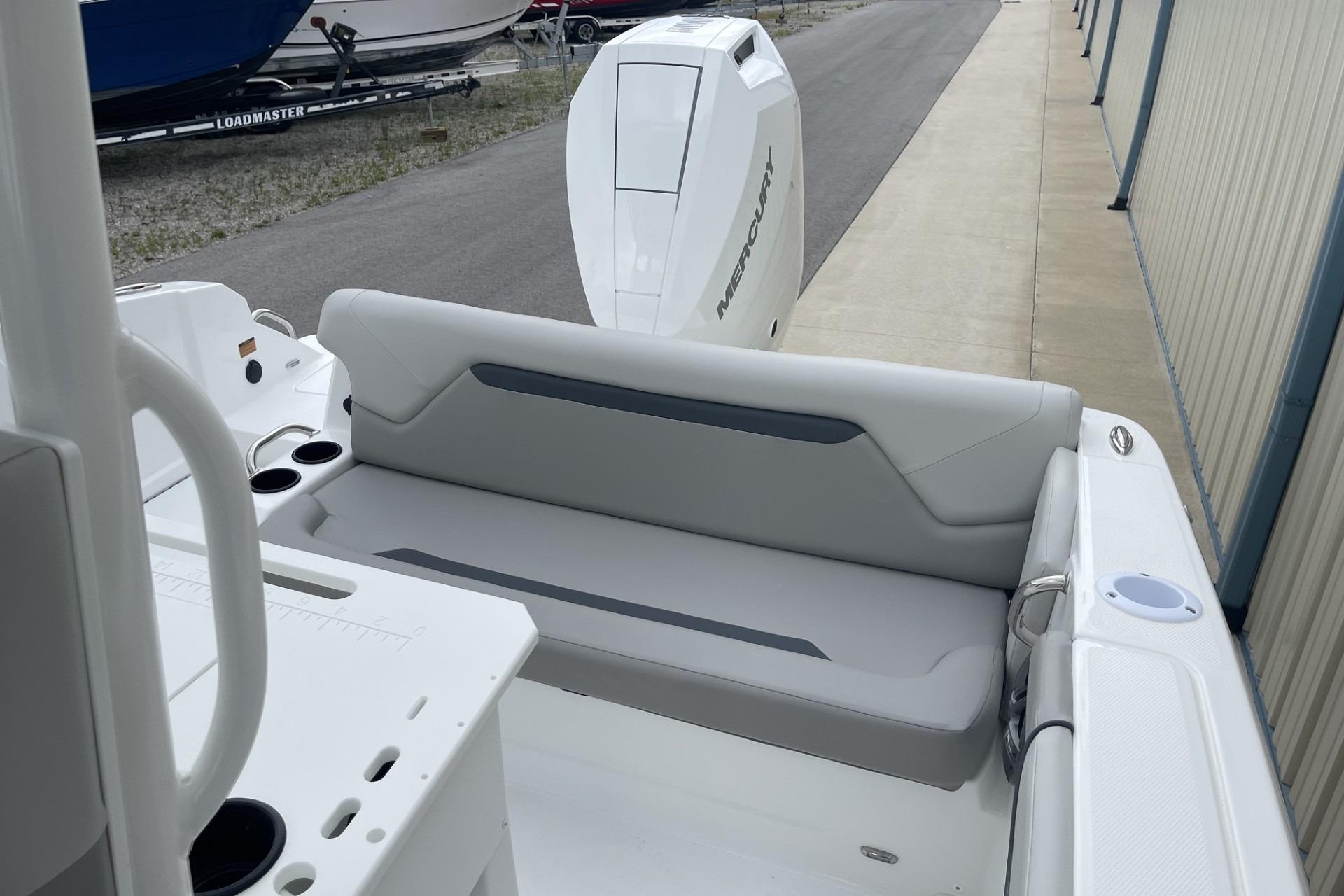 2026 Hurricane Center Console 24 OB boat with Mercury outboard engine and comfortable seating.
