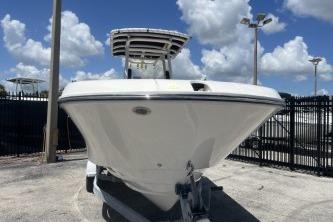 2023 Trophy T24 CC boat displayed outdoors under a clear blue sky.
