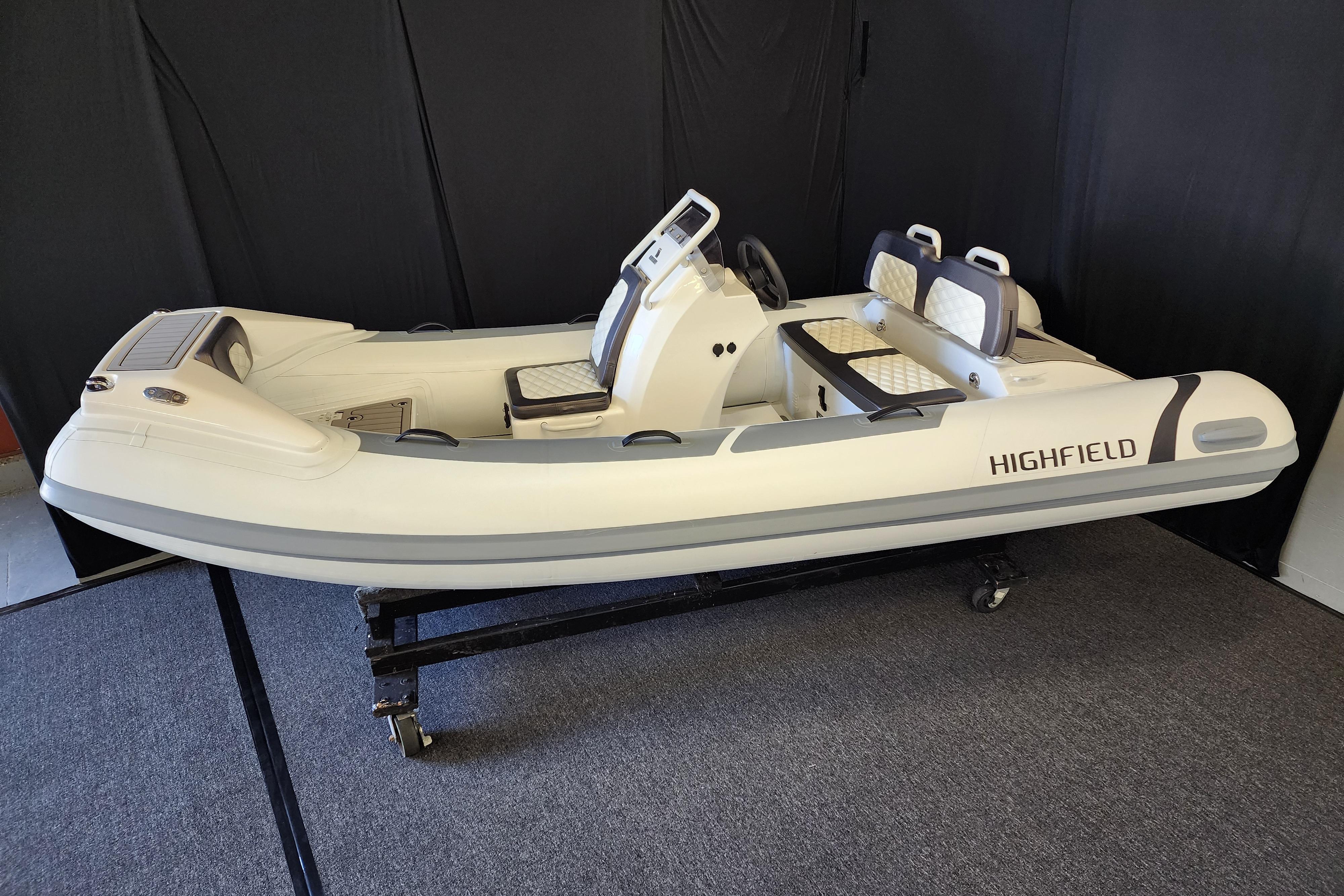 2025 Highfield Sport 390 inflatable boat on display, featuring sleek design and modern seating.