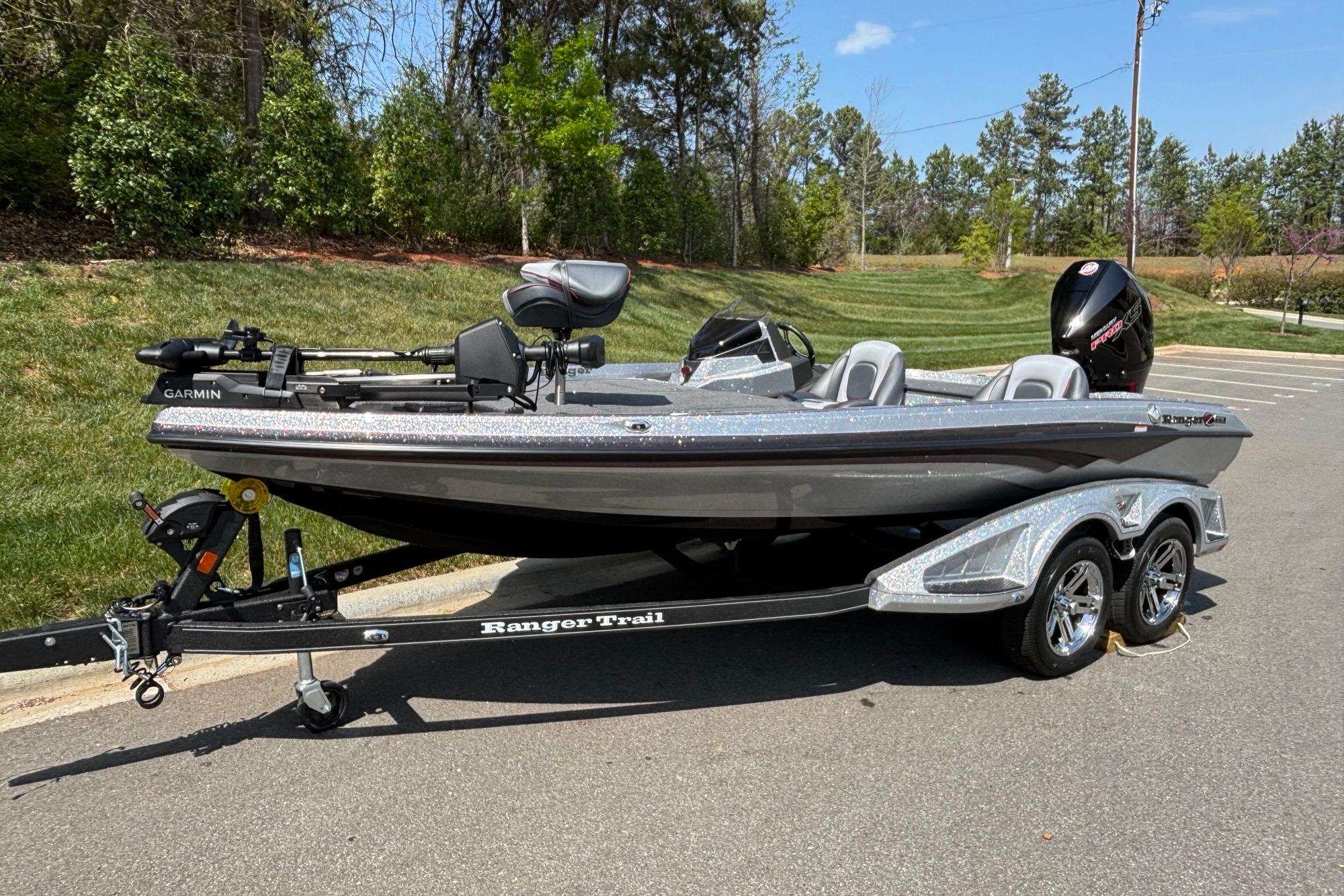 2026 Ranger Z518 Cup-Equipped boat on trailer, parked outdoors, featuring Garmin equipment.