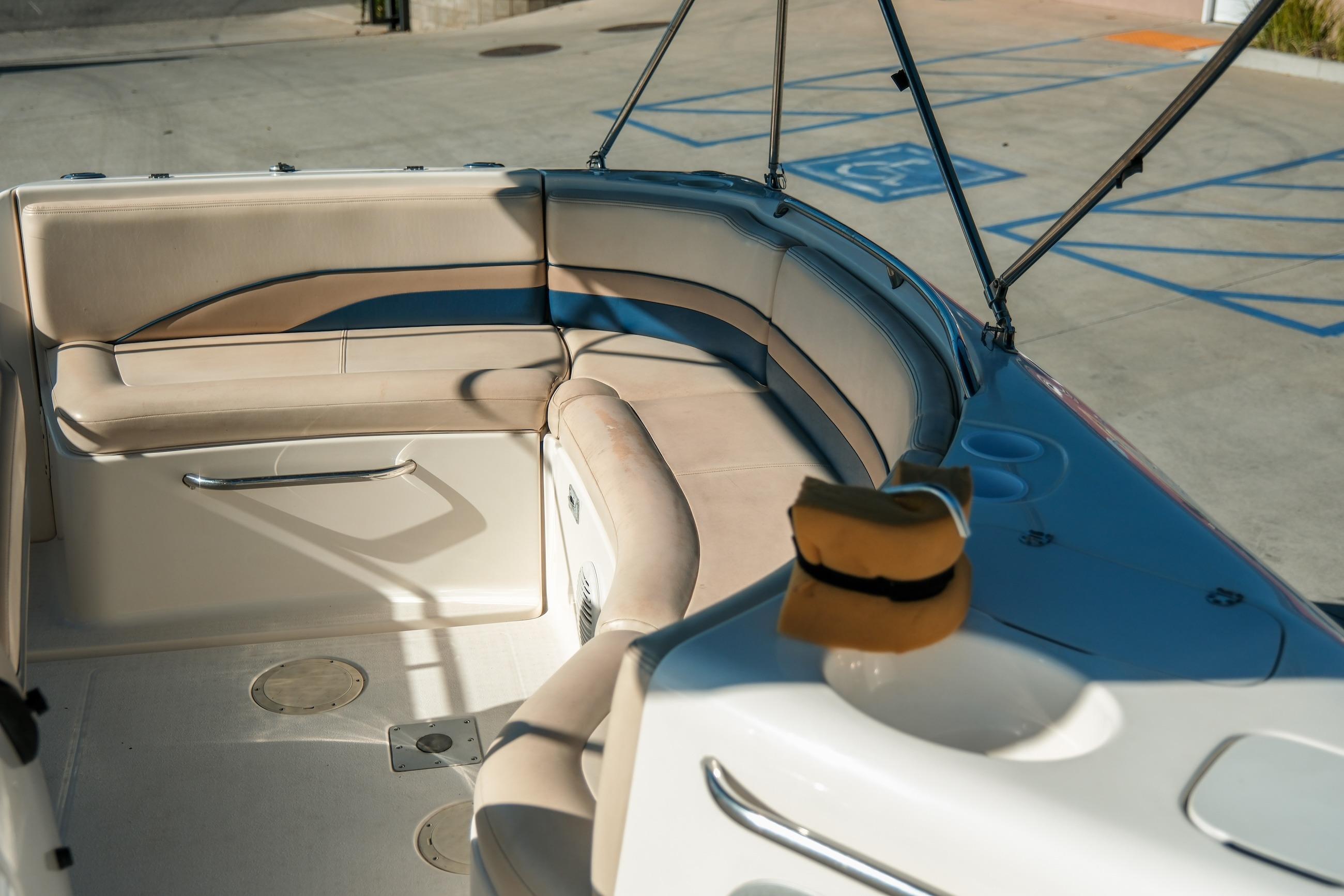 Interior view of a 1998 Chaparral 232 Sunesta boat with beige seating.