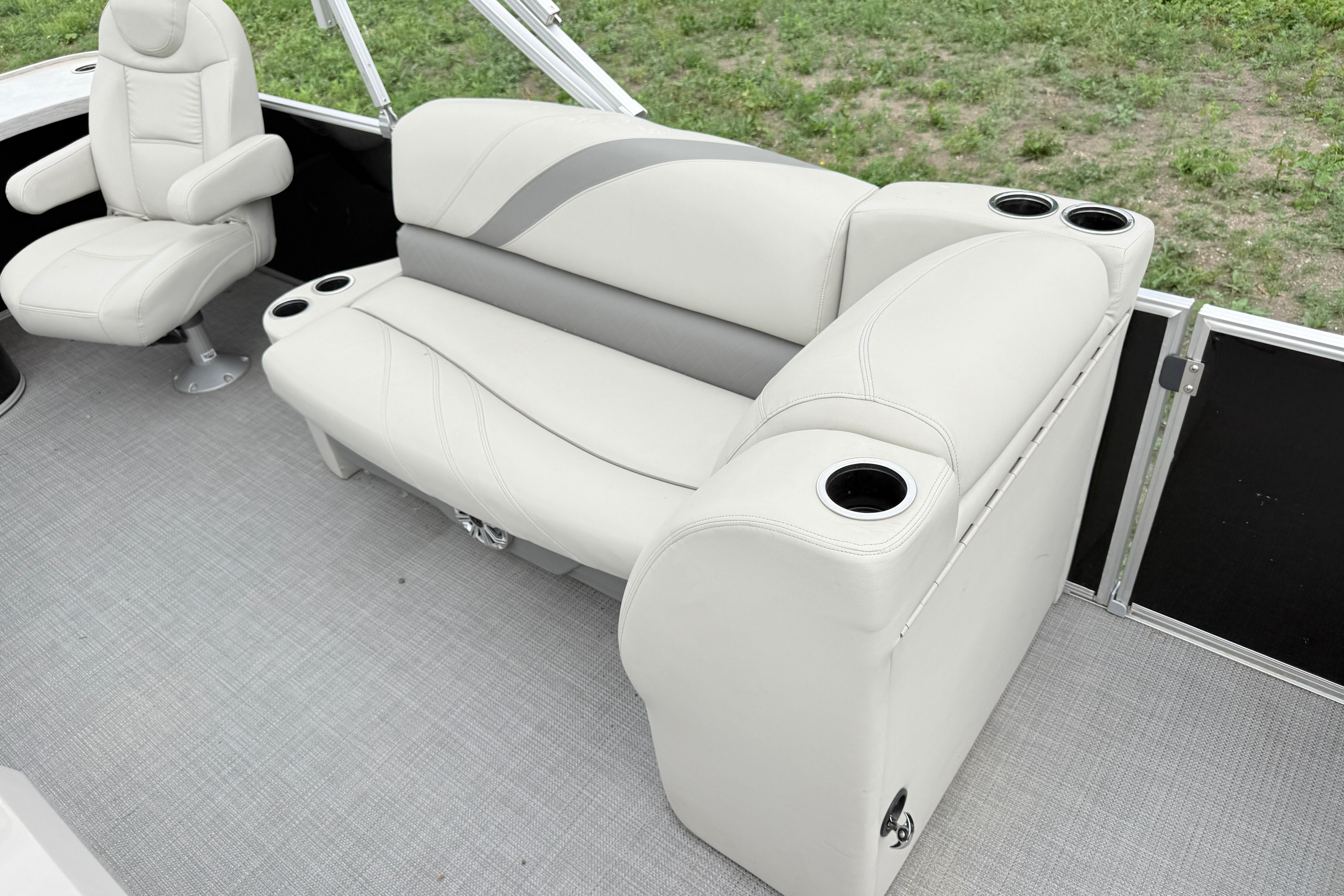 Luxurious seating on 2019 Sylvan 8522 Mirage Signature F-n-C pontoon boat.
