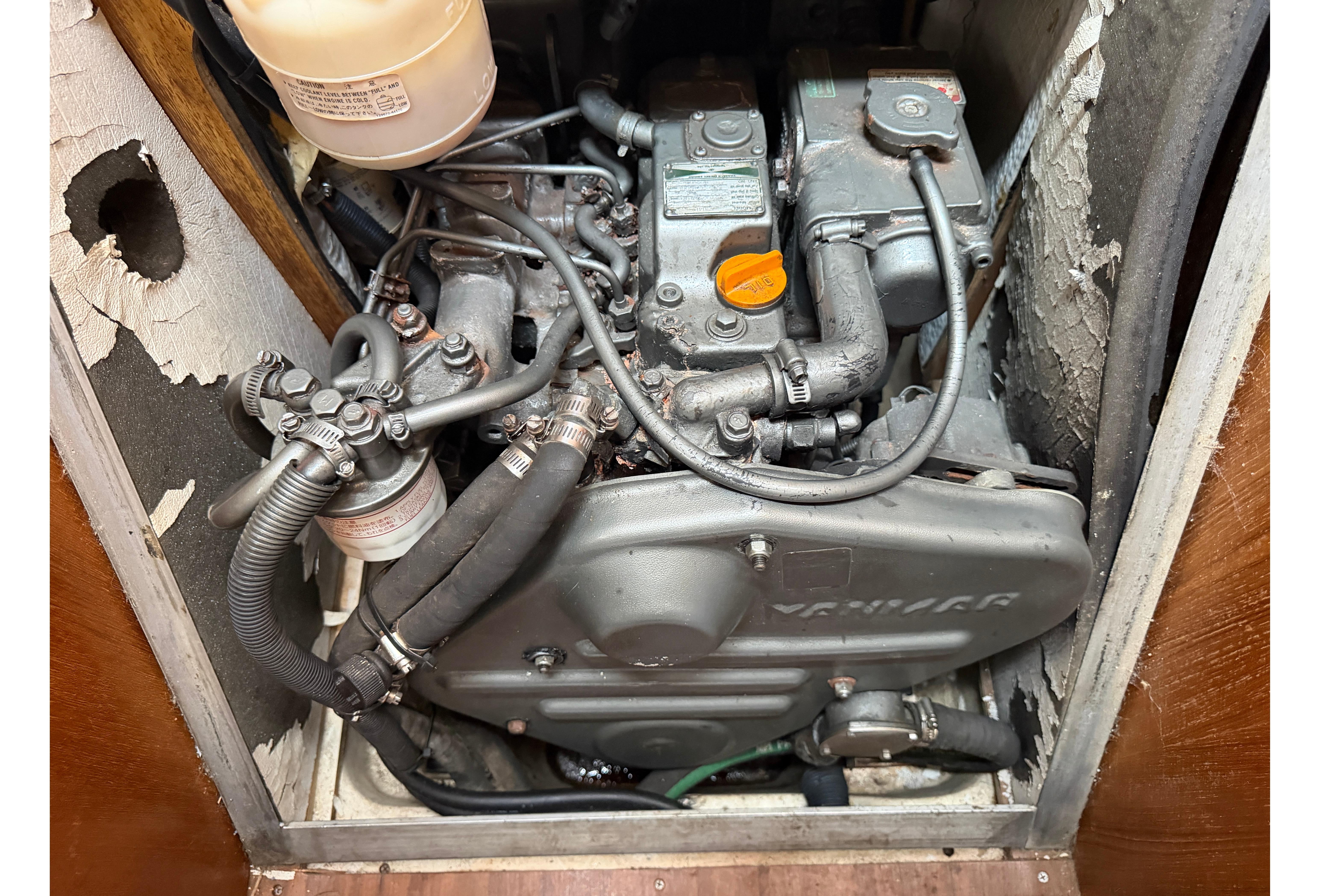 Engine compartment of a 2005 Hunter 38 sailboat, featuring a Yanmar diesel engine.