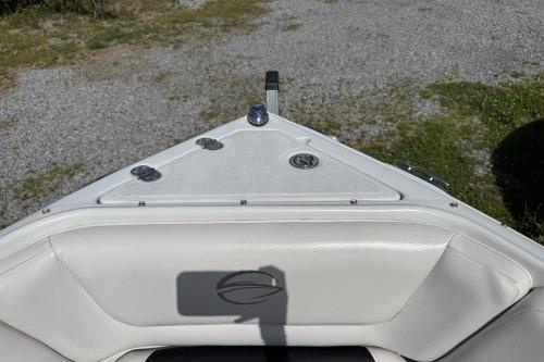 2012 Crownline 215 SS boat bow with white seating and deck fittings.
