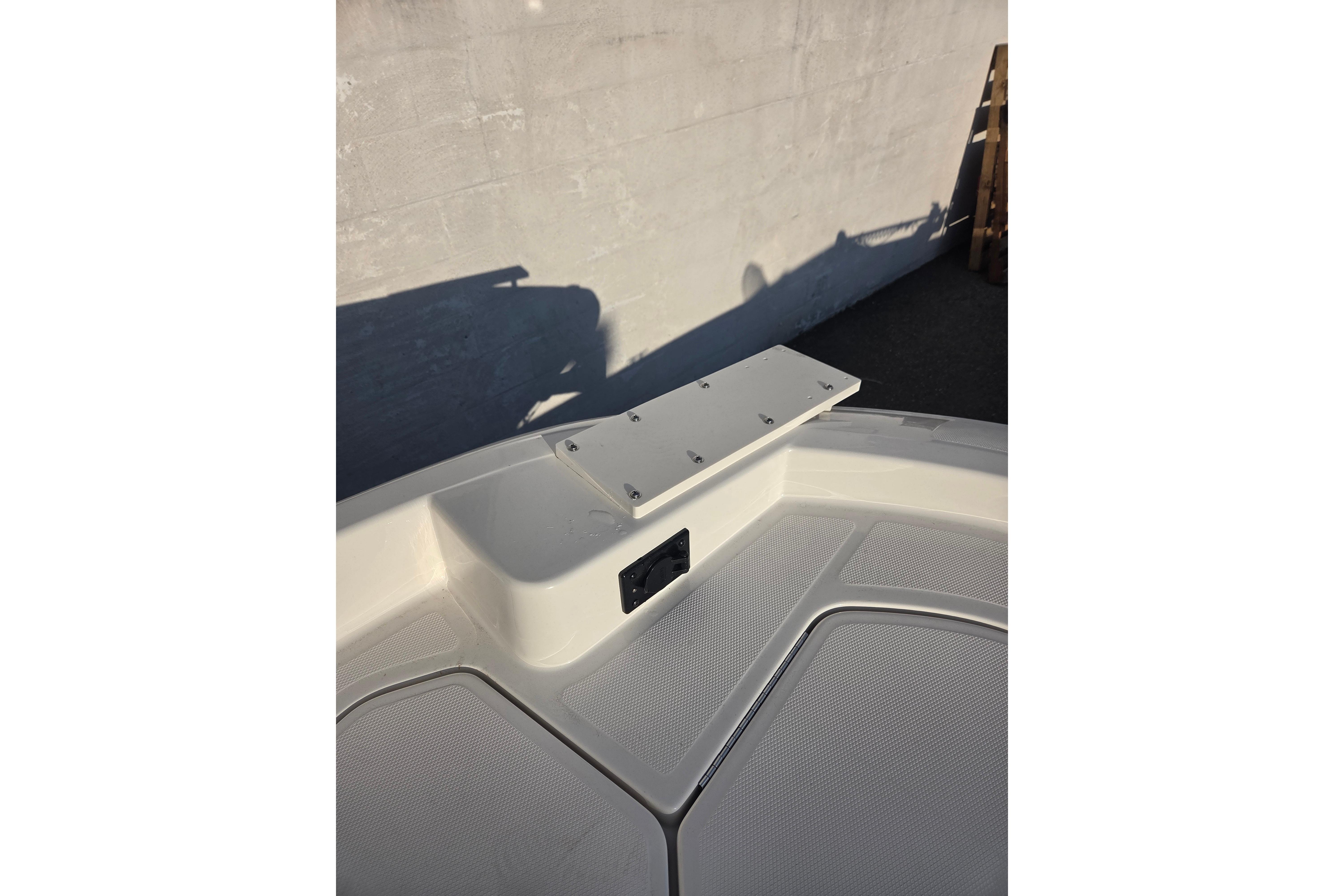 2026 Bayliner Trophy T18 boat deck with mounting bracket in sunlight.
