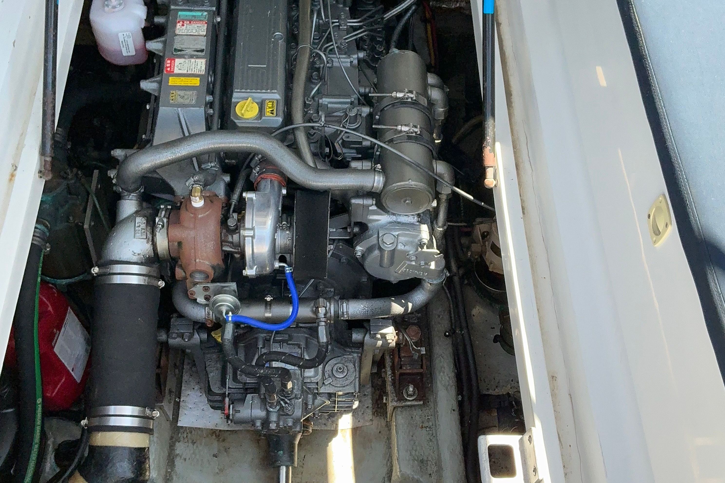 Engine compartment of a 1999 Mainship Pilot 30 boat.