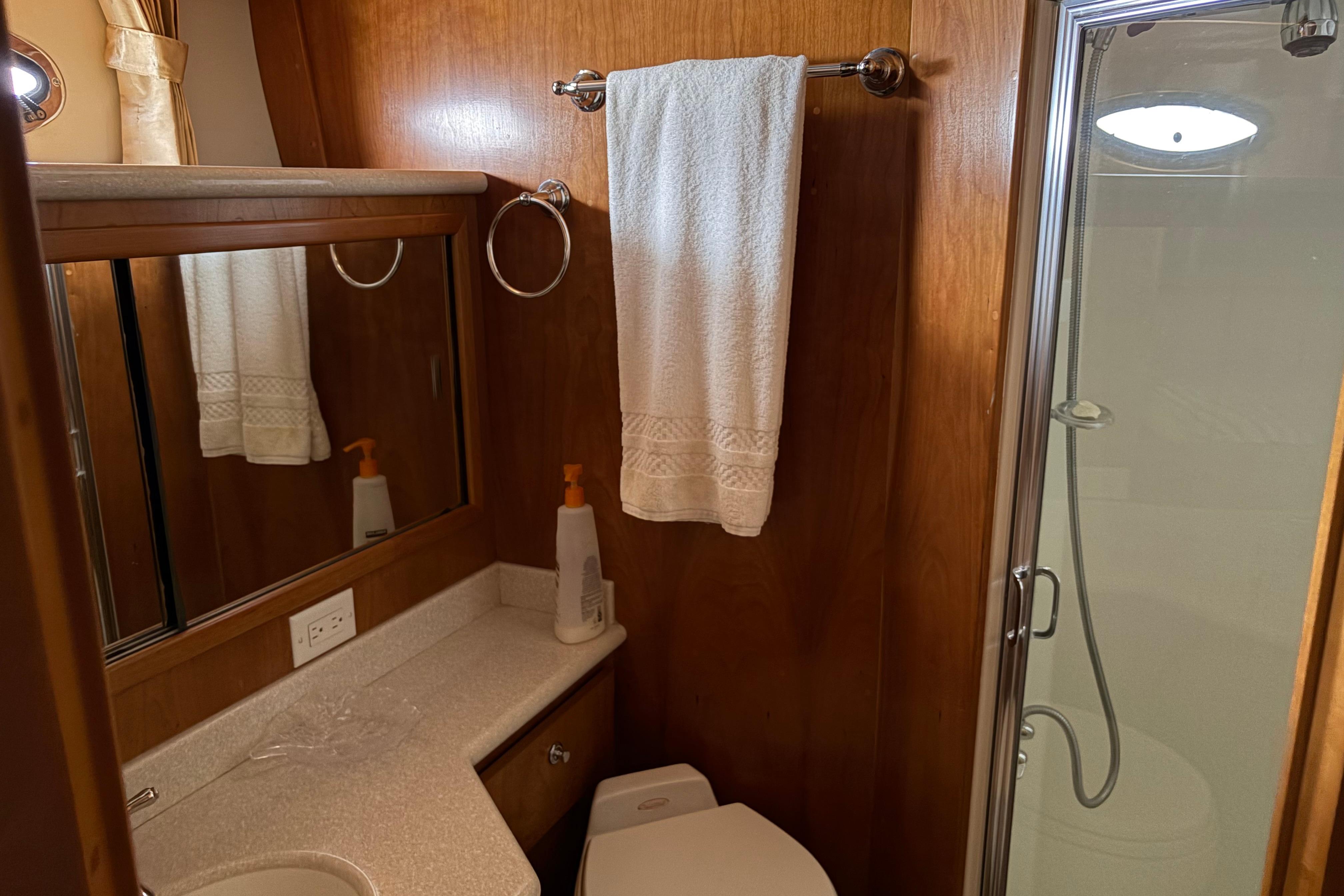 Bathroom interior of 2005 Navigator 53 PILOT HOUSE yacht, featuring shower and vanity.