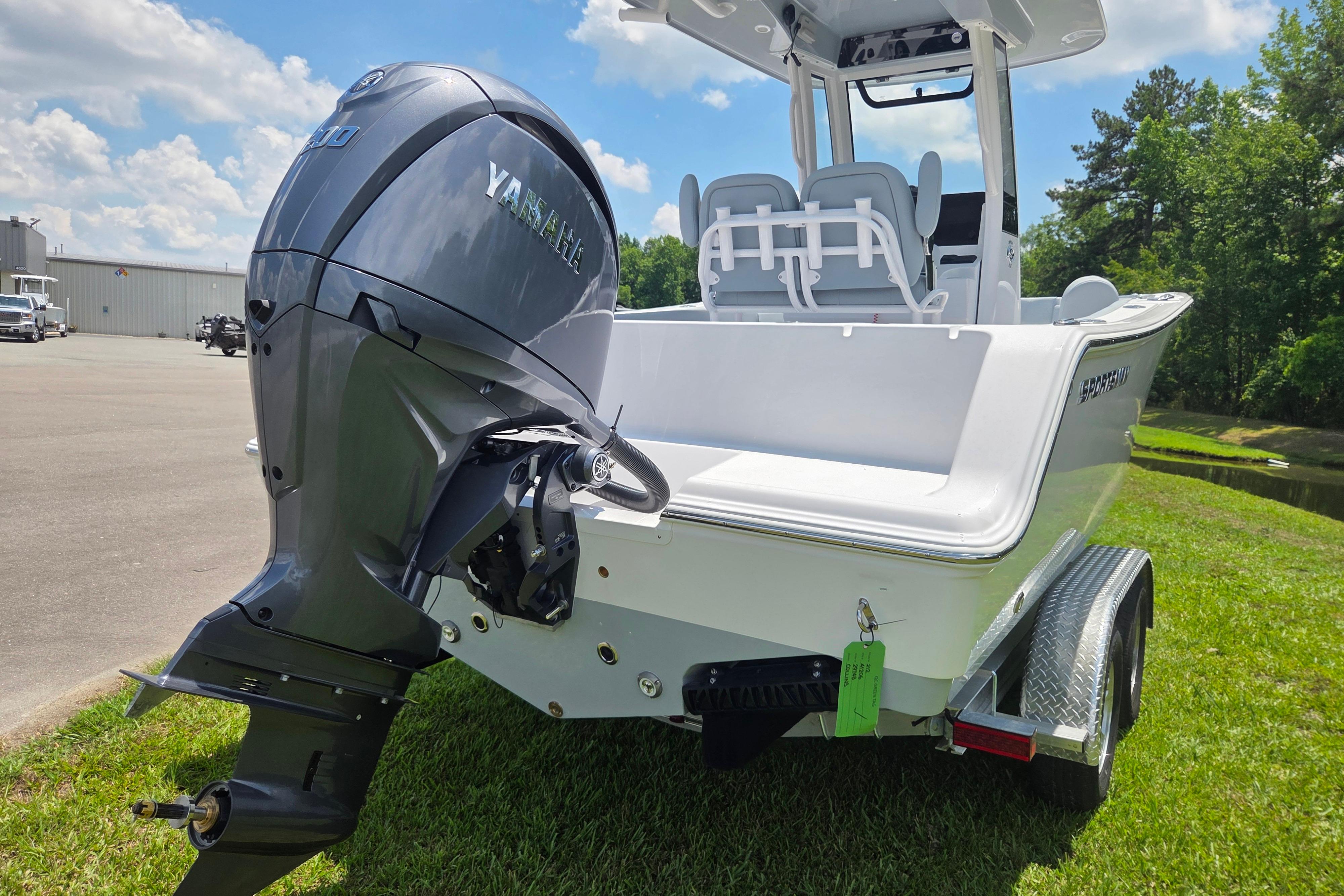 2026 Sportsman Open 212 Center Console boat with Yamaha engine on trailer.