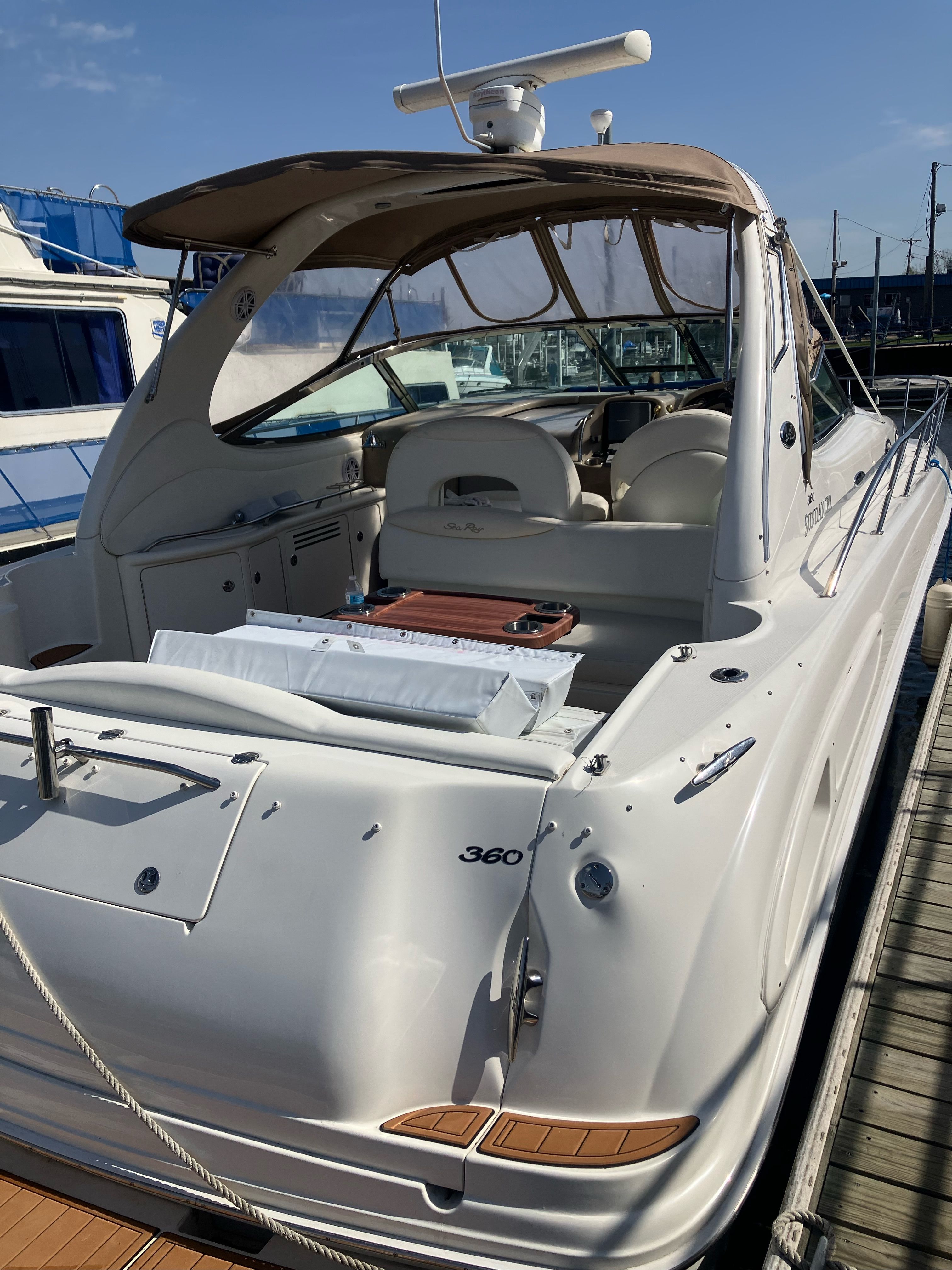 2002 Sea Ray 360 Sundancer yacht docked, featuring luxurious design.