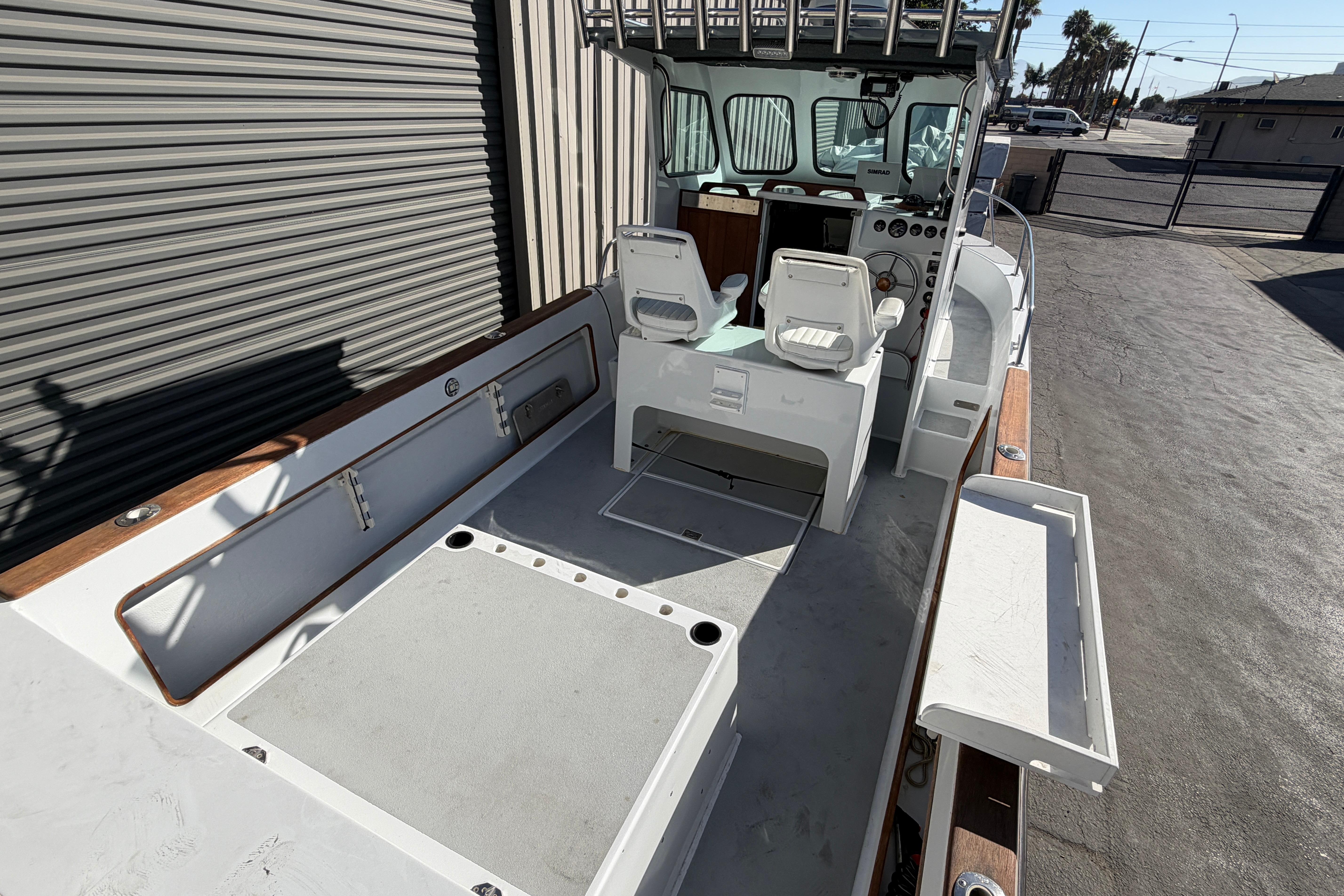 1986 Radon 21 Sport boat interior with dual seats and control panel.