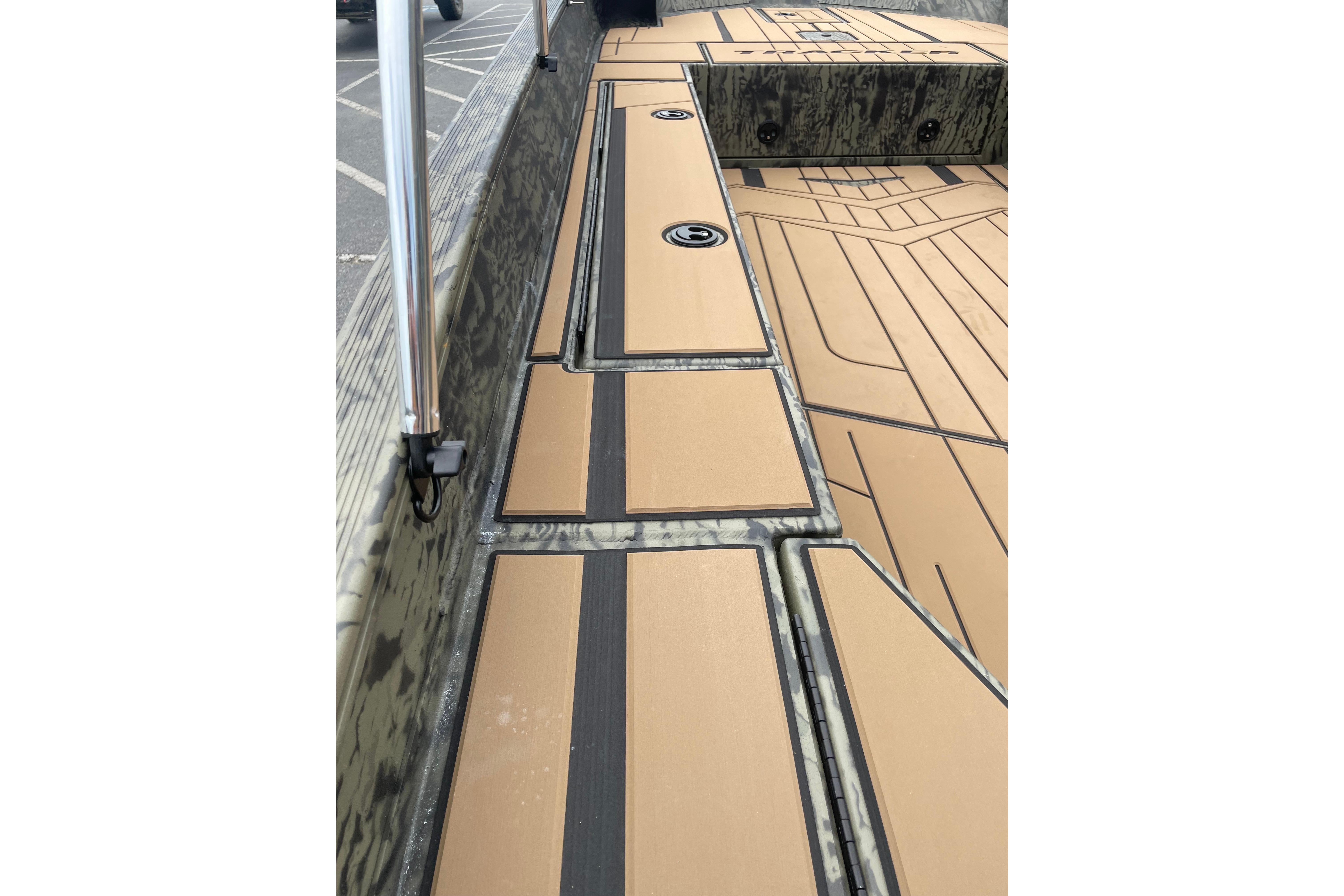 2026 Tracker Grizzly 1756 T Marsh boat interior with tan and black deck design.