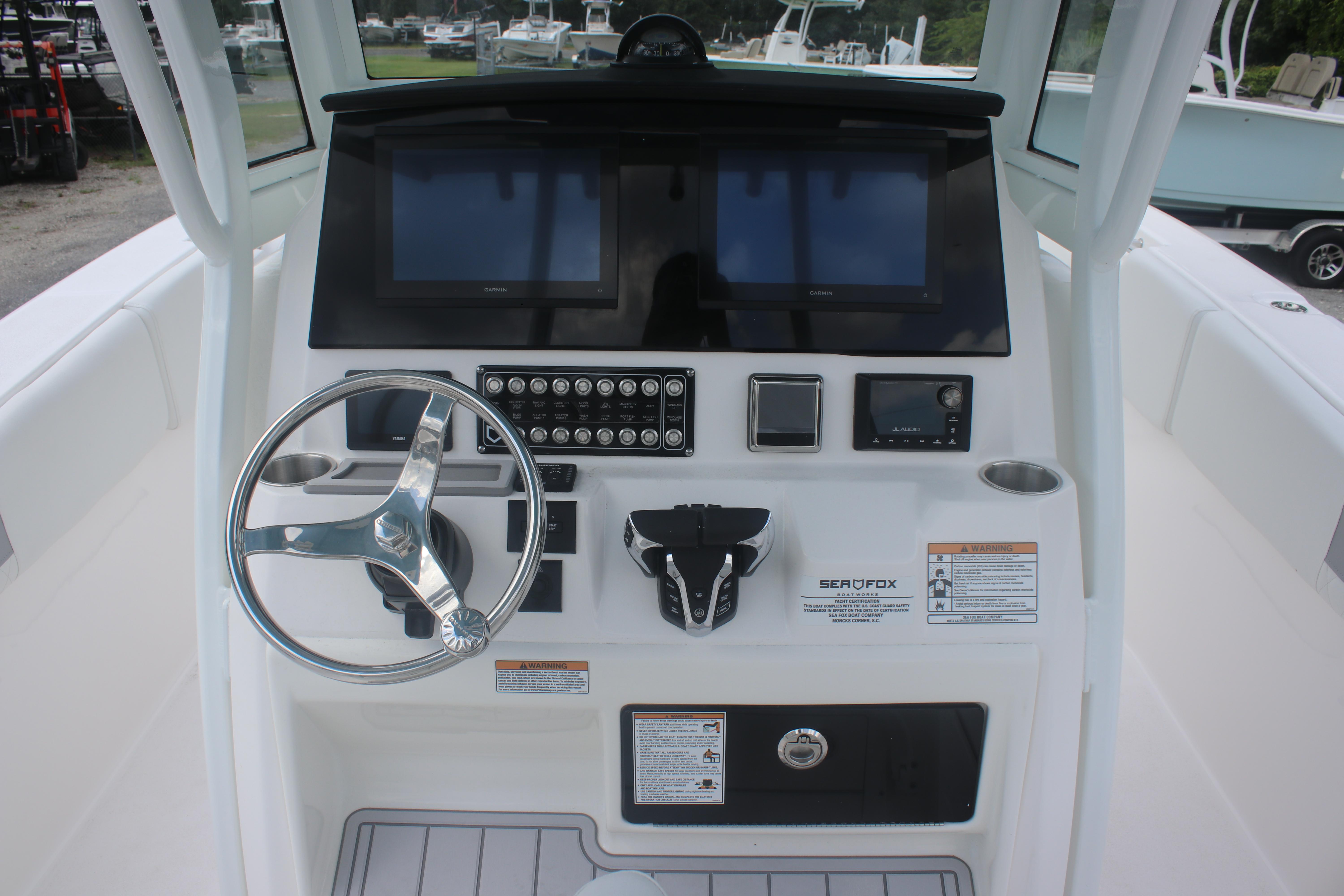 2026 Sea Fox 288 Commander helm with dual screens and modern controls.