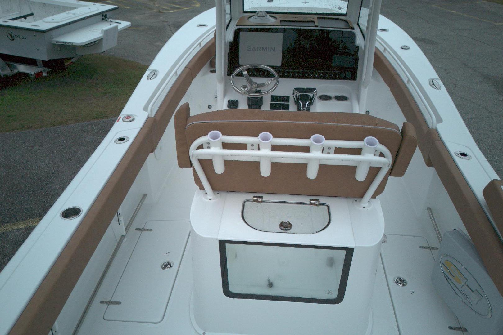 2026 Sea Hunt Gamefish 25 boat interior with helm, rod holders, and seating.