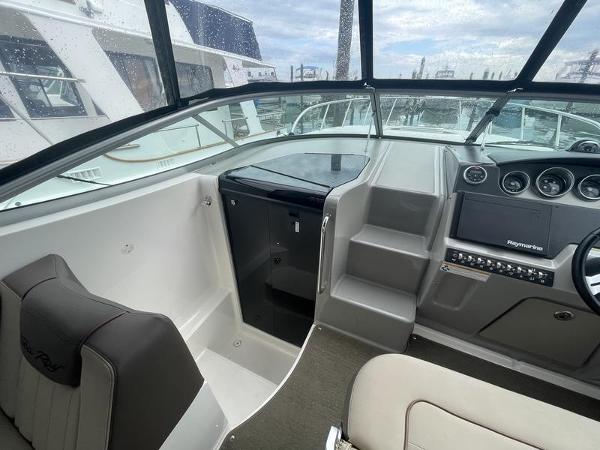 Interior helm of 2014 Sea Ray 310 Sundancer with modern controls and seating.