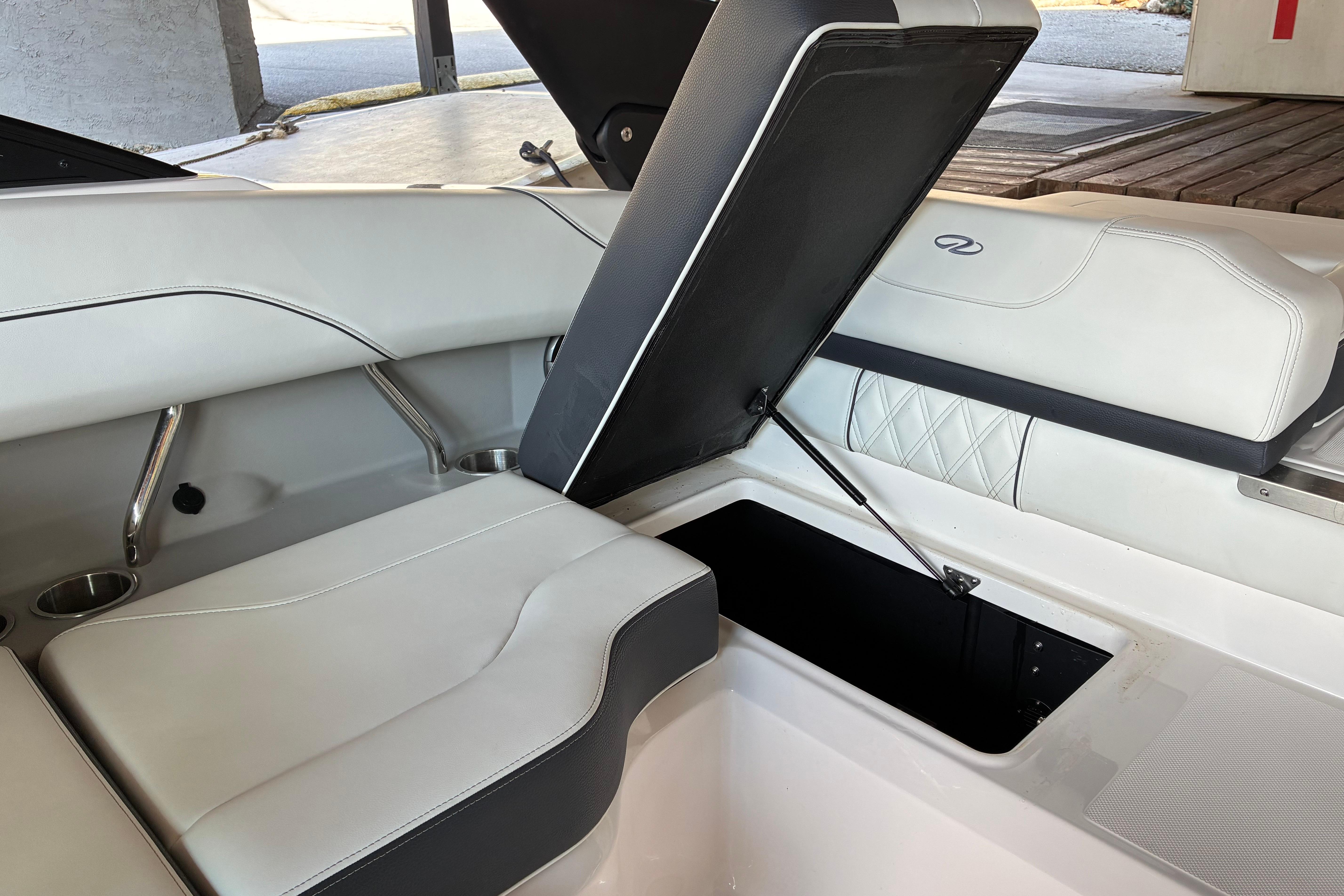 2025 Regal LS2 boat interior with open storage compartment and luxurious seating.