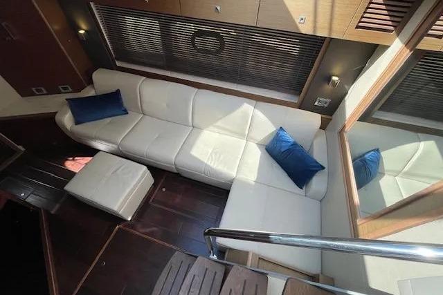 Luxurious interior of 2016 Sea Ray Sundancer 510 yacht with white leather seating.