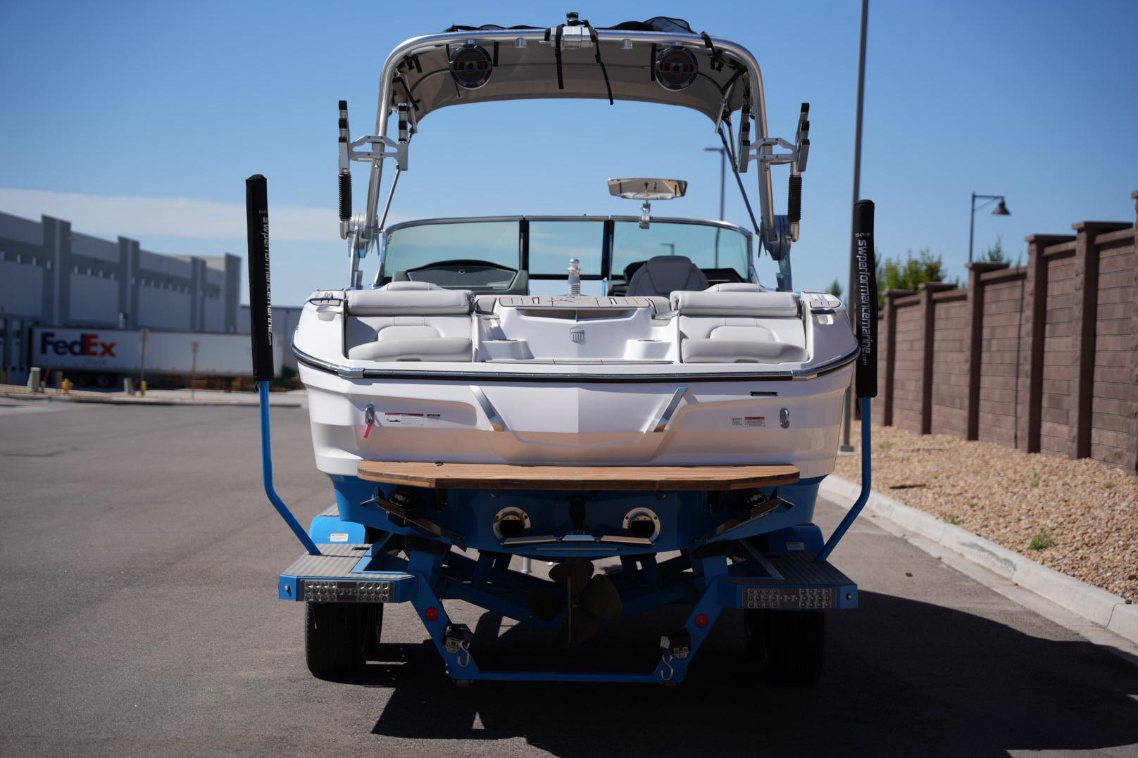 2020 MasterCraft X22 boat on trailer, parked outdoors.